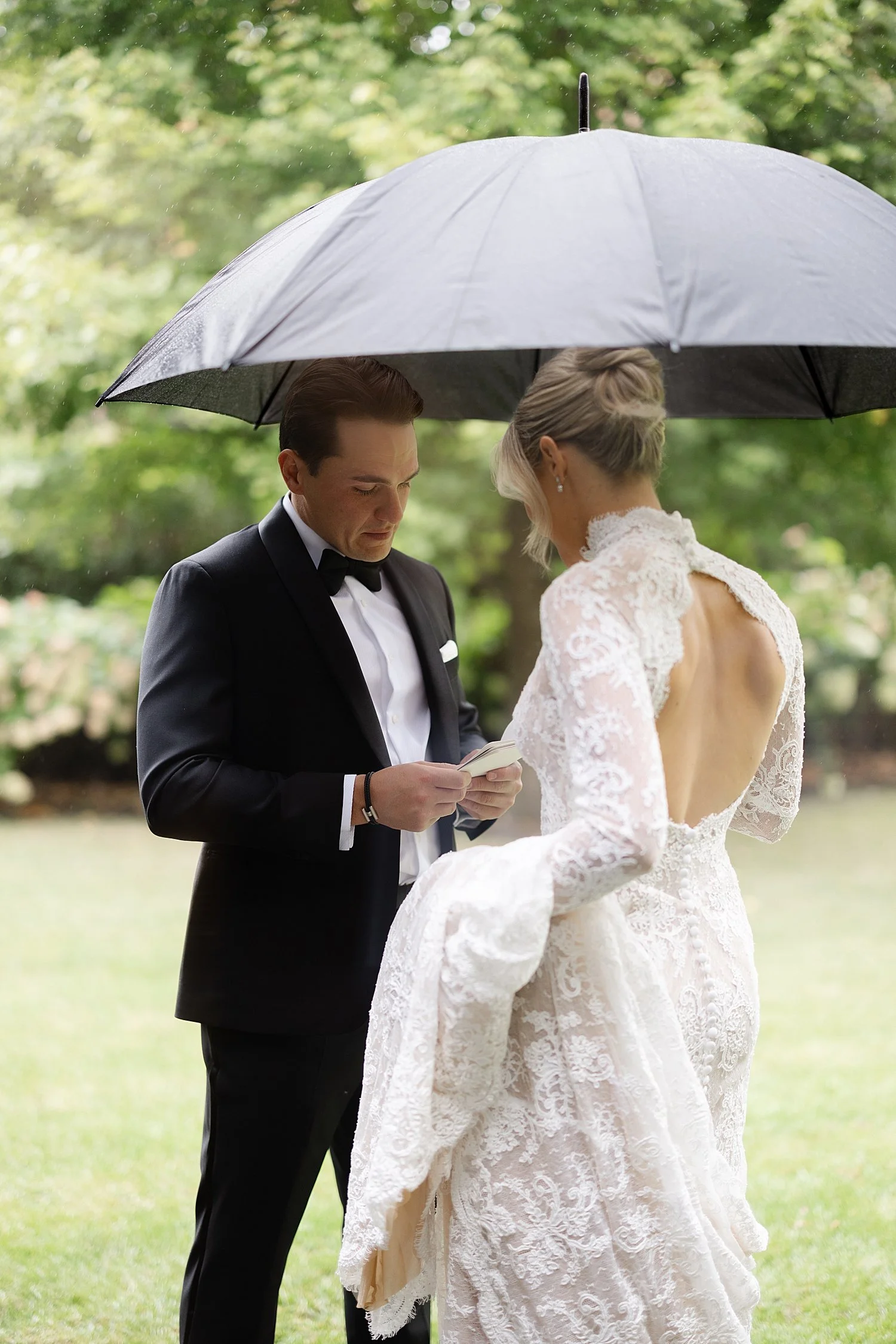  bride and groom exchange private vows in the rain 