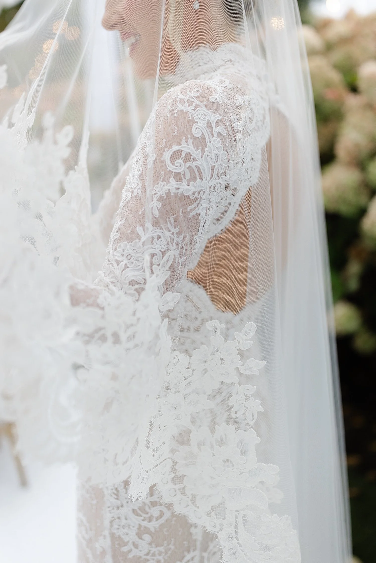  bride in elegant wedding dress with intricate lace design and open back 