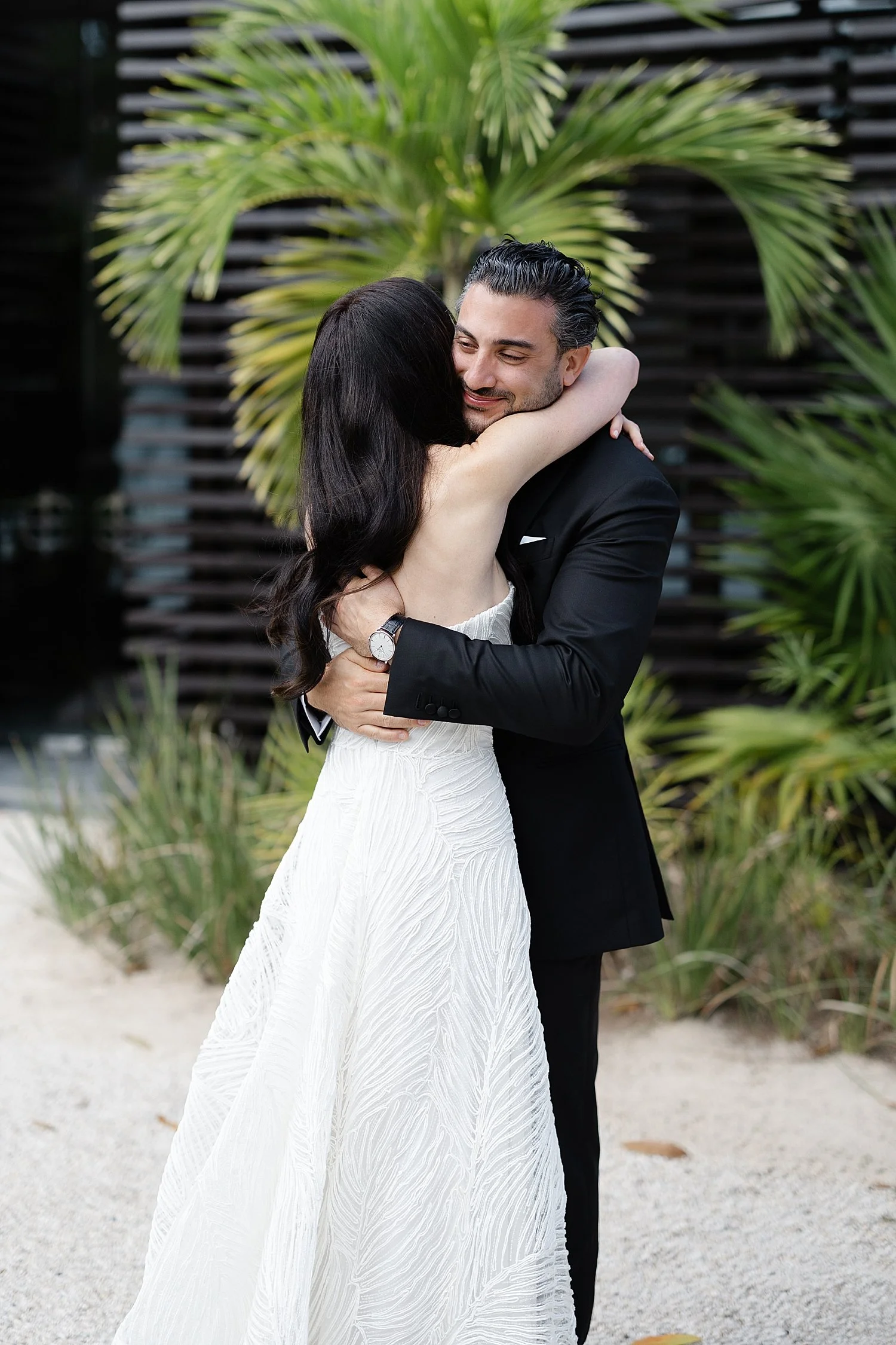  bride and groom hug during first look 