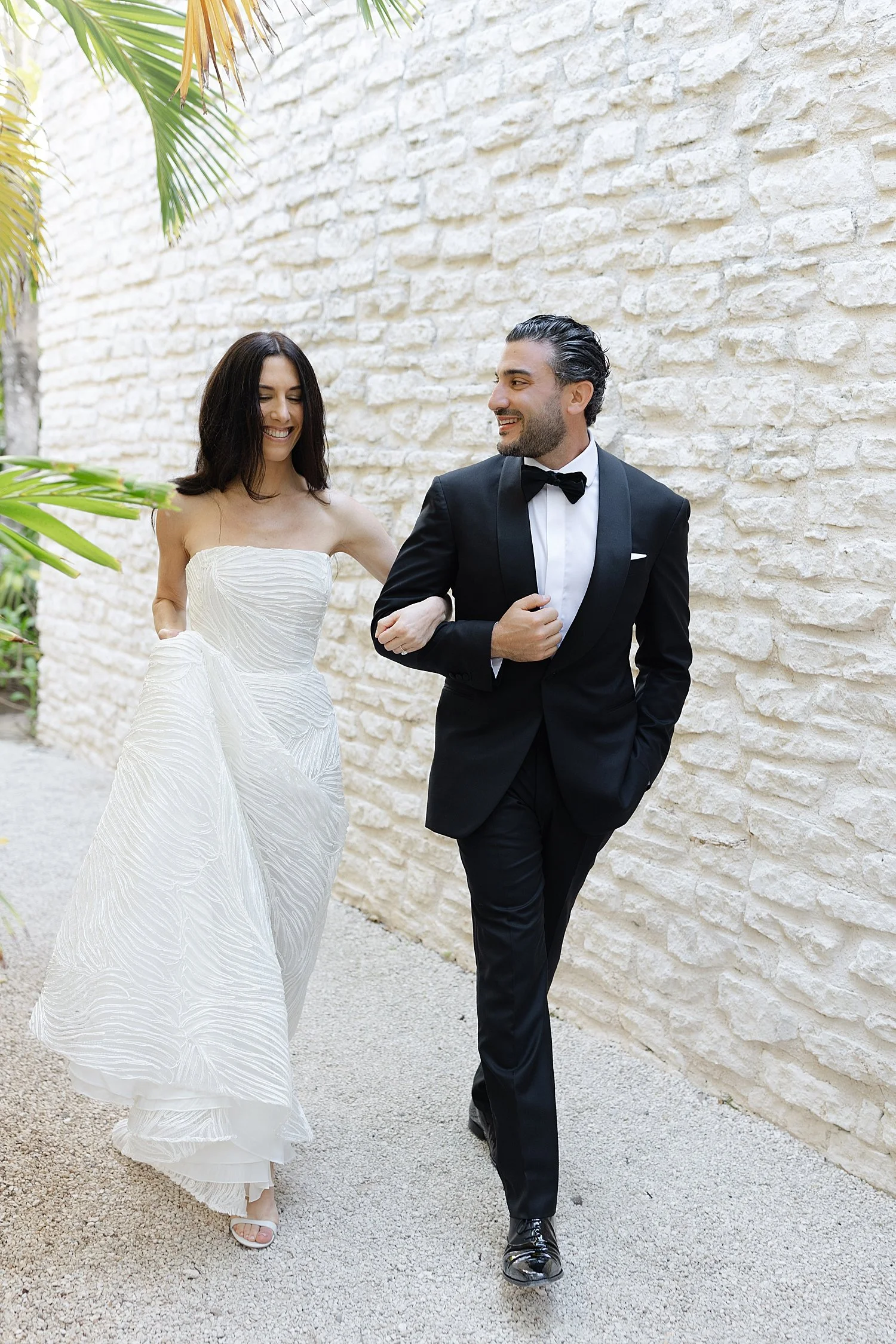  couple walking together on path at Mexico resort  