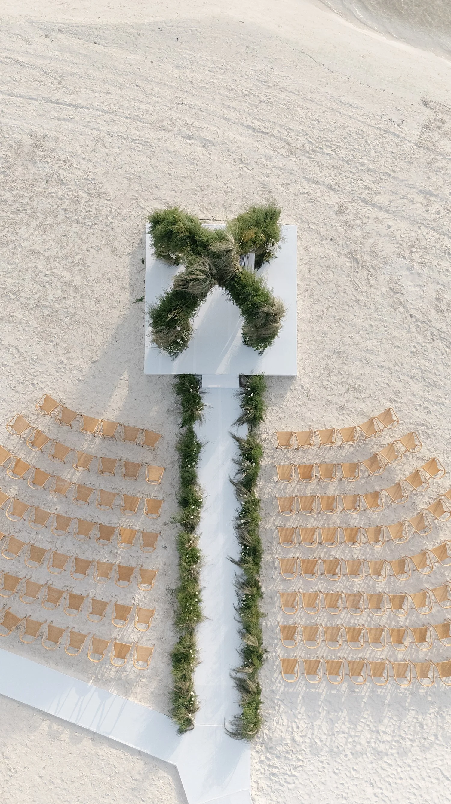  aerial view of outdoor wedding ceremony on Mexico beach at NIZUC Resort  
