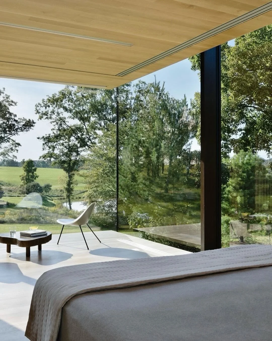 // LM Guest House // 

"Designed as a contemplative retreat for weekend visitors, this guest house is situated on a rock outcropping that overlooks a trout pond and open farmland with vast unobstructed views to the landscape. The house integrate