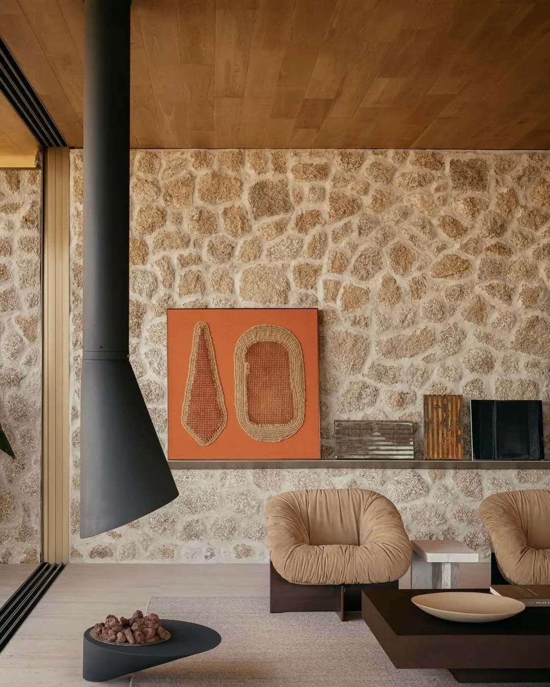 // Praia Brava House // 

"...Wood runs throughout the project, from the facade to the ceilings and built-in elements, giving the interiors a warm, cohesive feel. A helical staircase becomes a key feature within this palette, connecting levels i