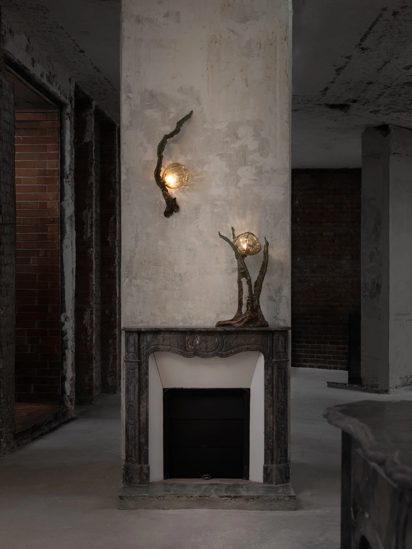 A surreal shooting of the POSIDONI lighting collection by @emilie.lemardeley made with patinated bronze and hand blown glass