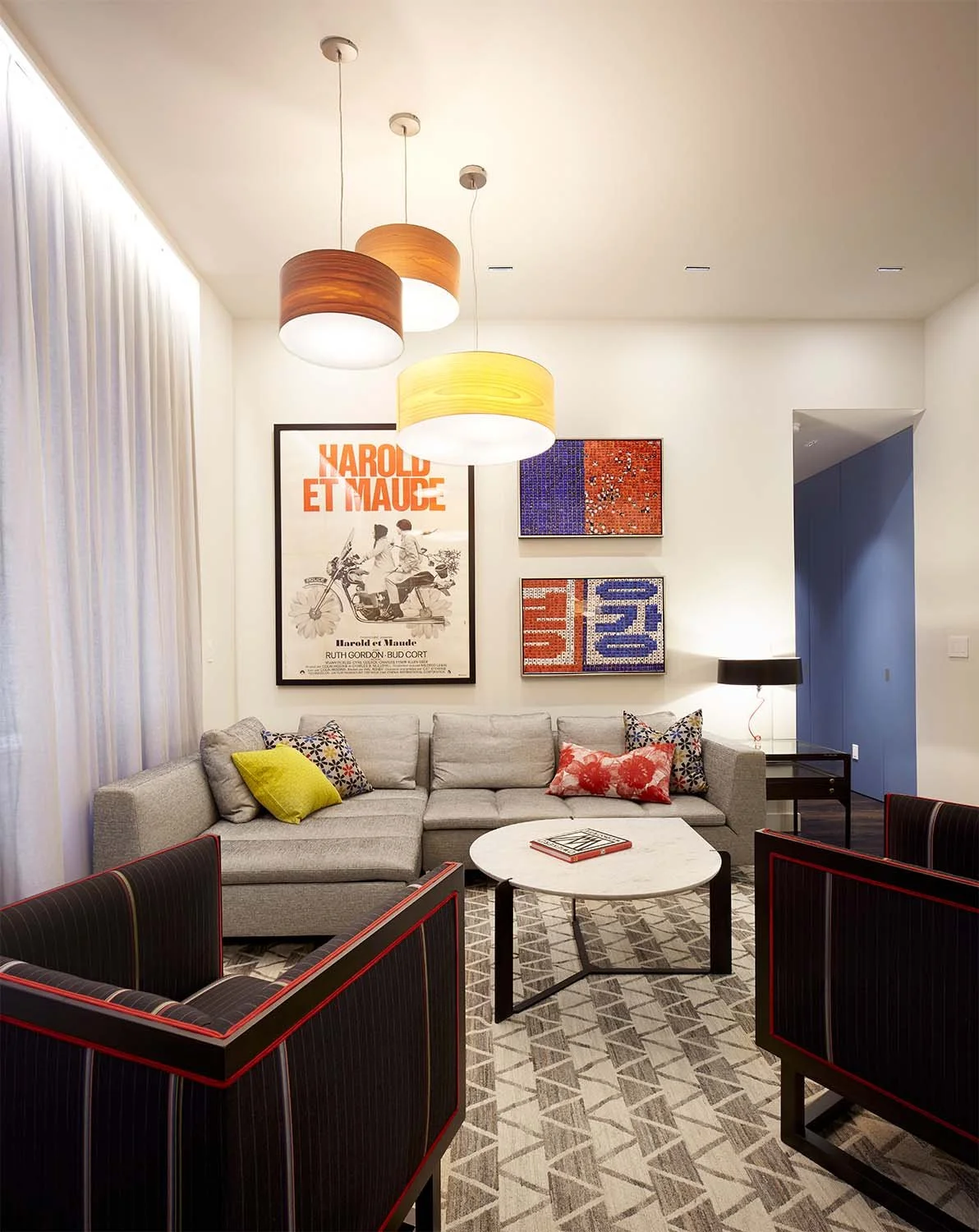 ..the colors and patterns across the room.
A hint of blue visually leads into…
