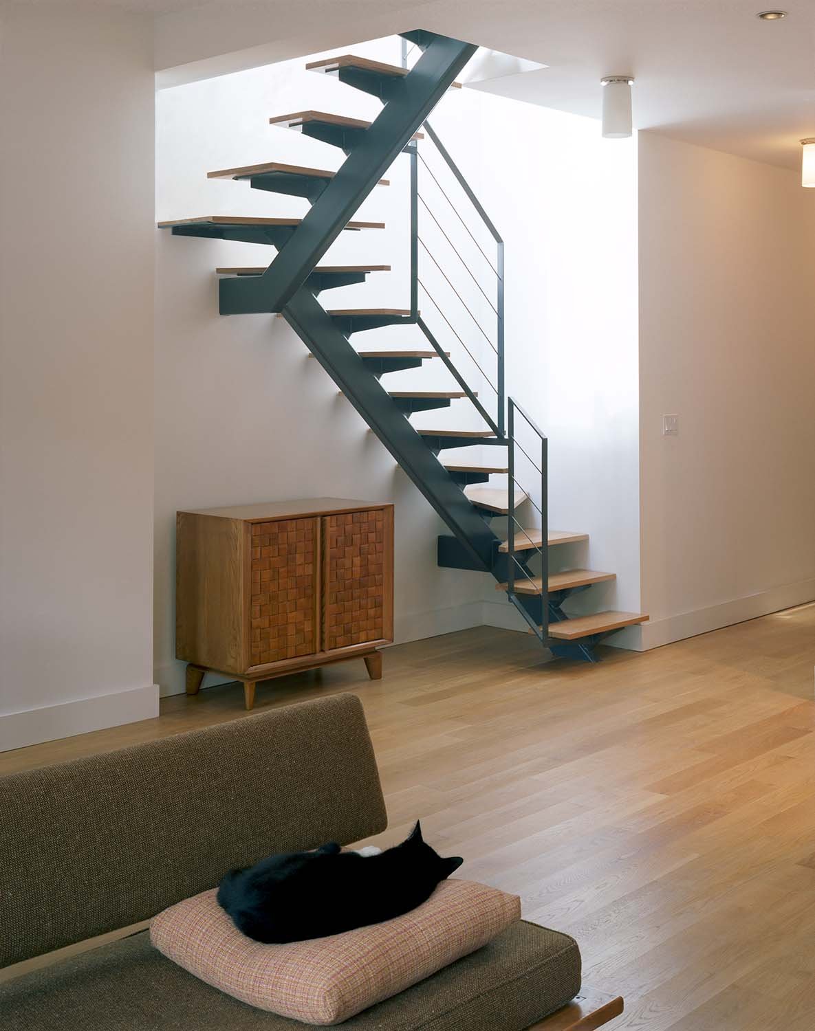The penthouse stairs bring light into the center of the floor below.