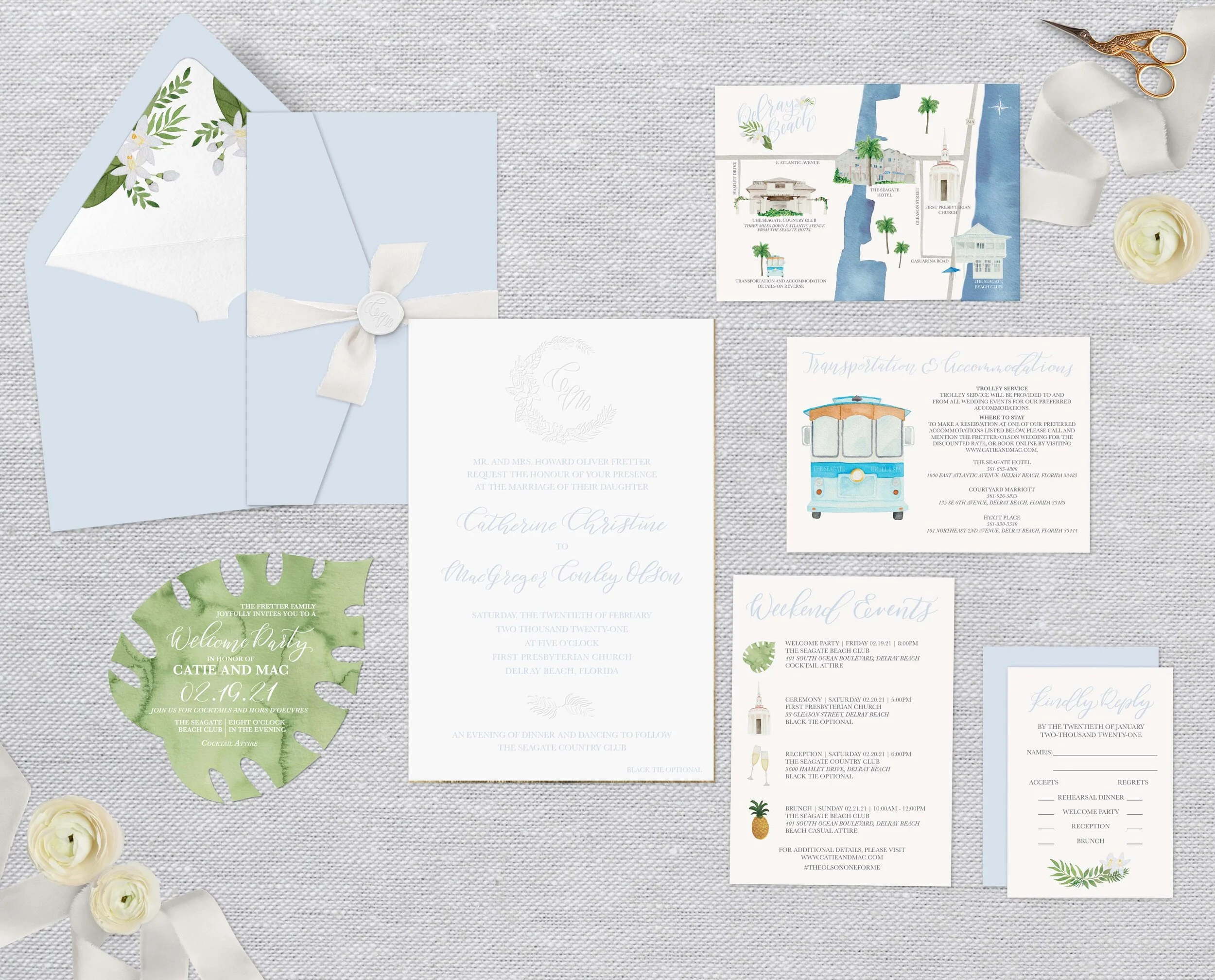 Elegant wedding invitation suite on textured background with pastel blue envelope, floral accents, and various informational cards like RSVP and map, surrounded by decorative ribbon and flowers.