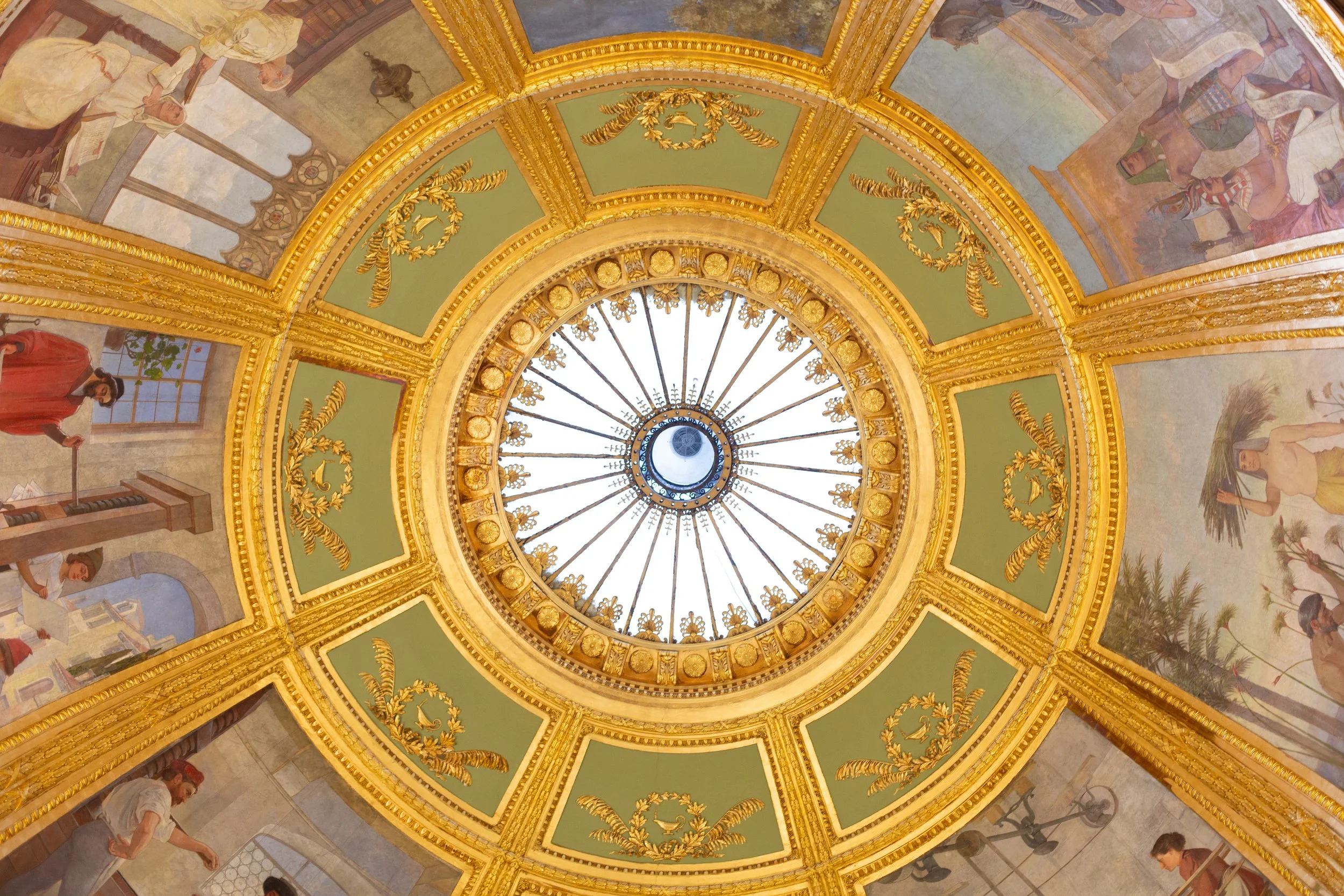 the ceiling of a library. gold with paintings. photo by film photographer briana raucci in CT. James Blackstone library on 35mm film