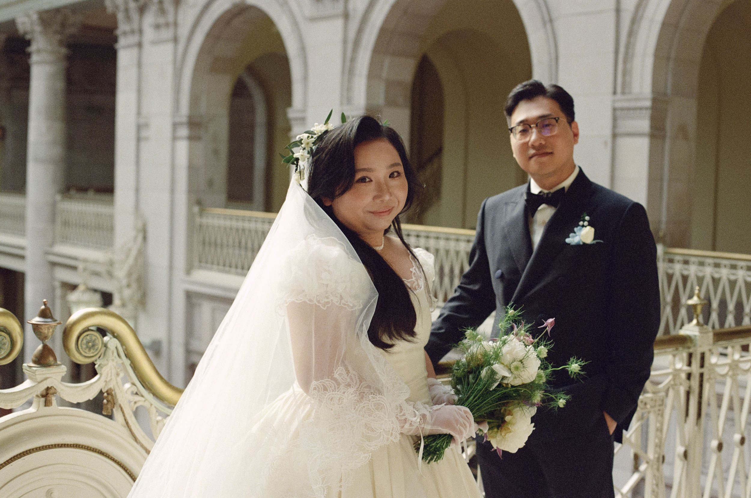 wedding at Hartford City Hall in hartford ct on 35mm film. portra 800 wedding photo by Briana Raucci, Connecticut and destination elopement photographer. Couple eloping at Hartford City hall smiling at camera