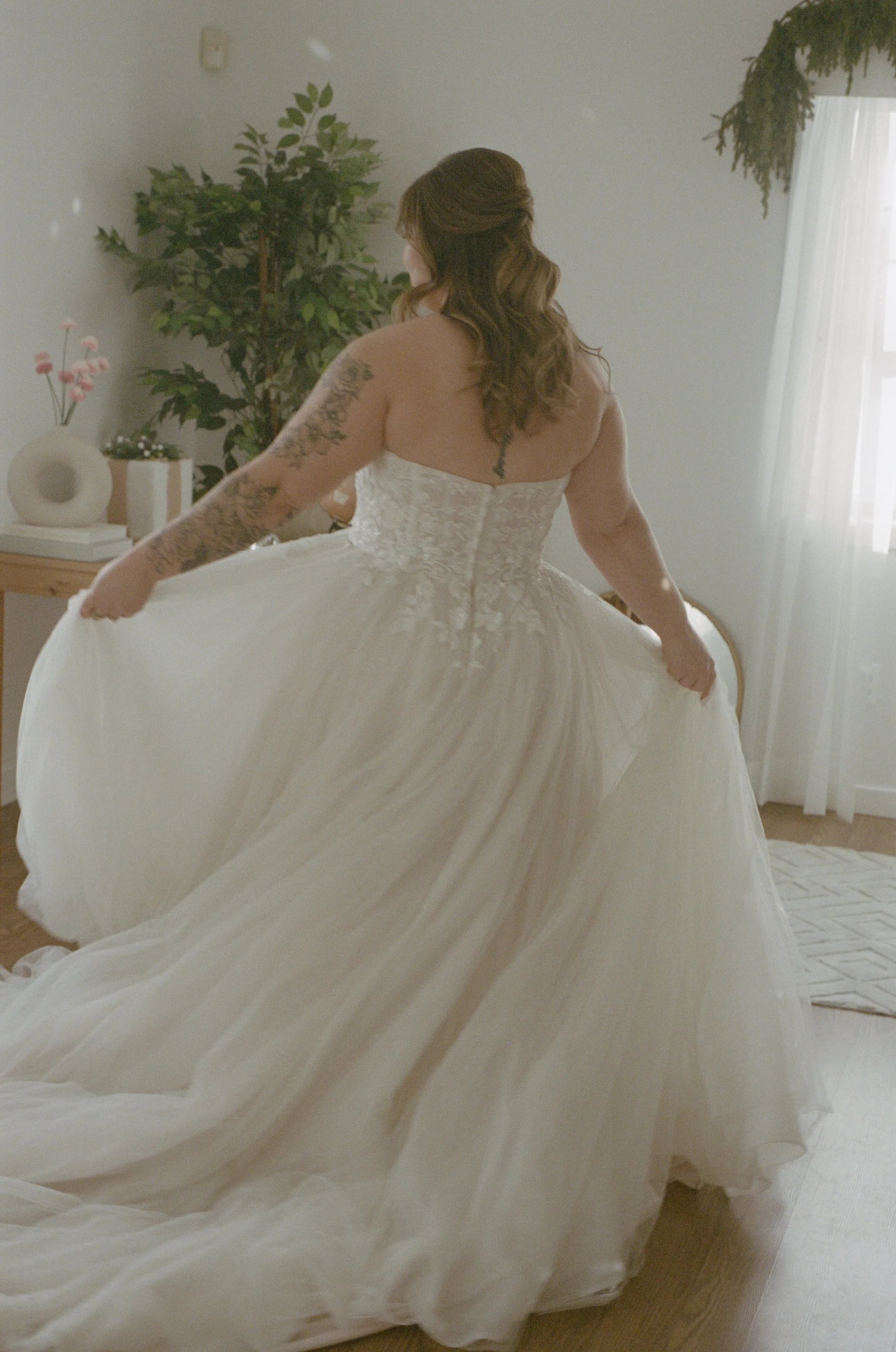 Bride twirls in her wedding dress on 35mm film. Film photography by CT wedding photographer Briana Raucci