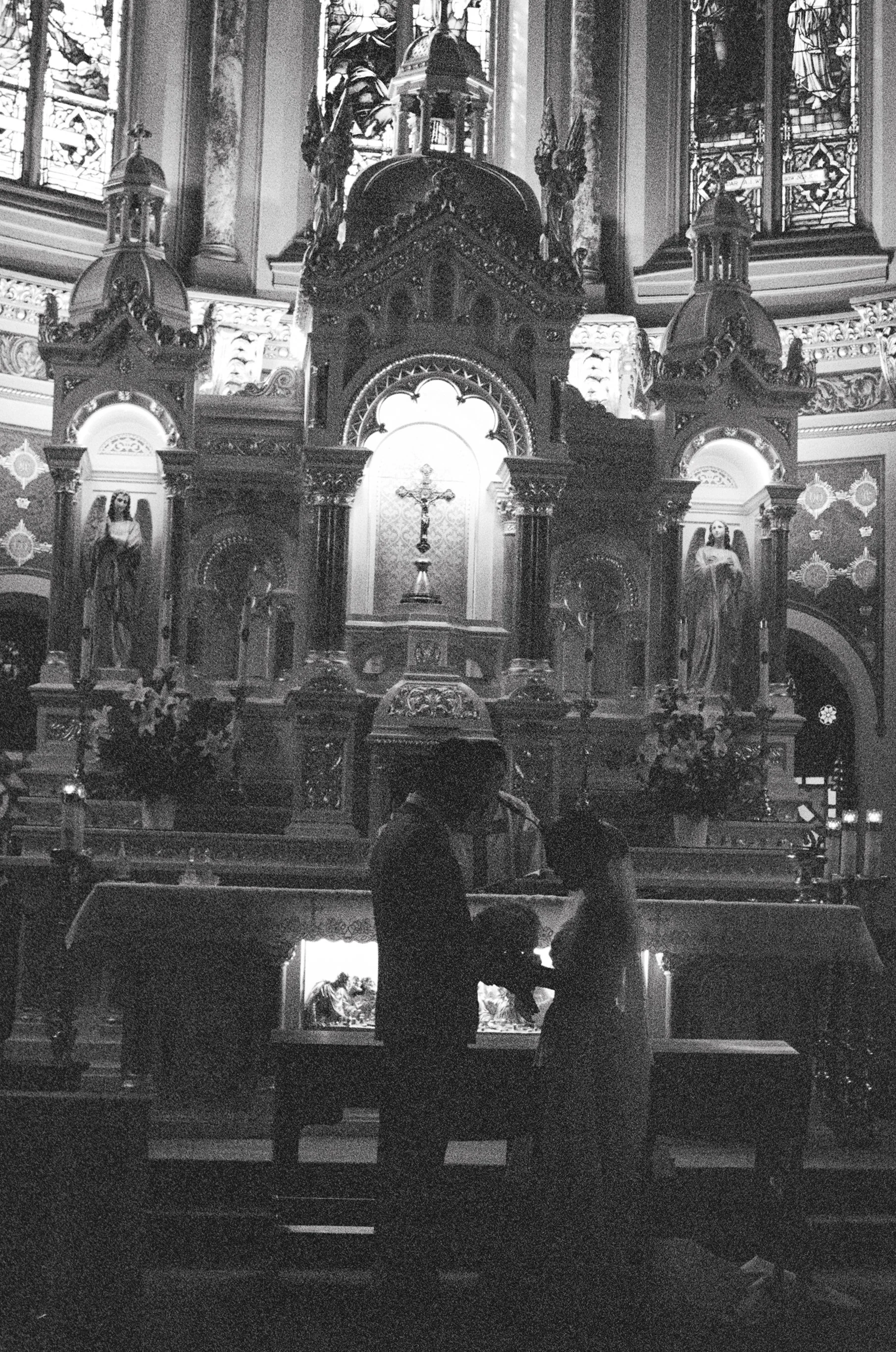 Couple exchange rings in a church by CT film photographer Briana Raucci