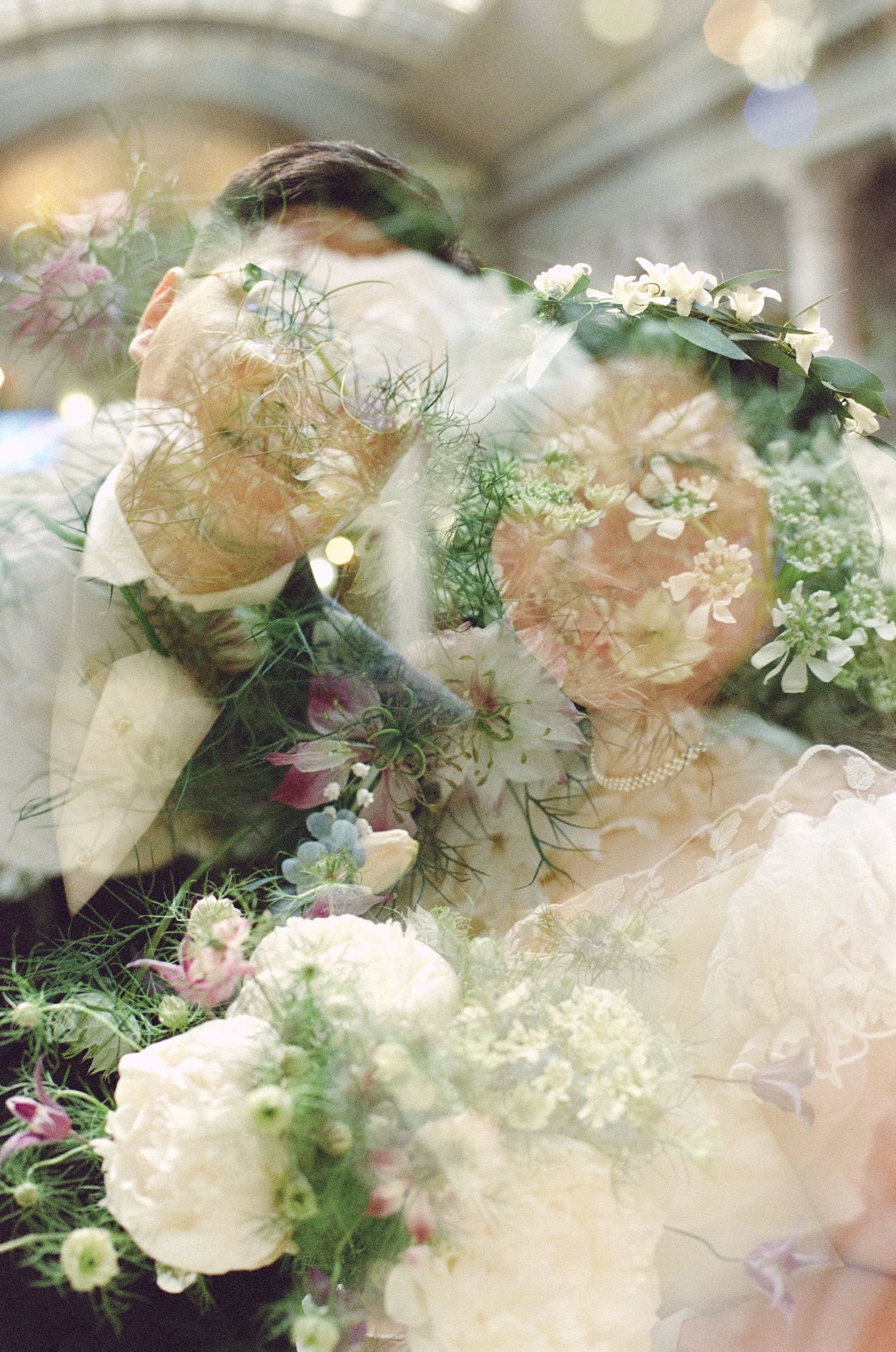 Double exposure on film. Wedding double exposure by CT wedding photographer Briana Raucci. 35mm film photograph of husband and wife overlayed with flowers