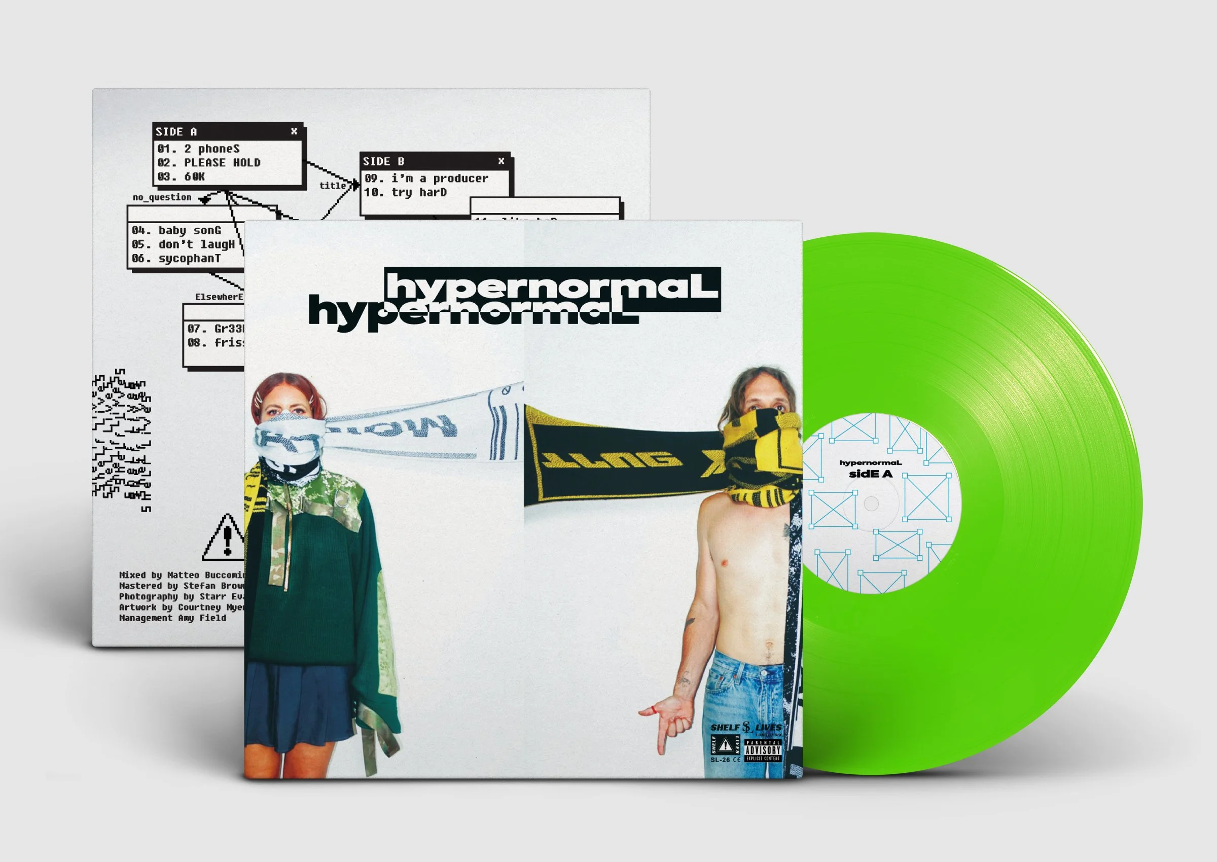 Green vinyl record with album cover art featuring two people, one wearing a mask and scarf, the other shirtless with a scarf, surrounded by text and graphics.