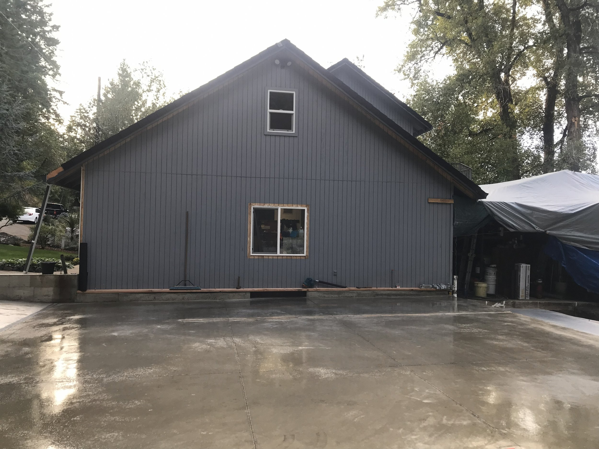 A two-story house existing house is waiting patiently to welcome the garage that will be built adjacent to it near the Winchester OR region