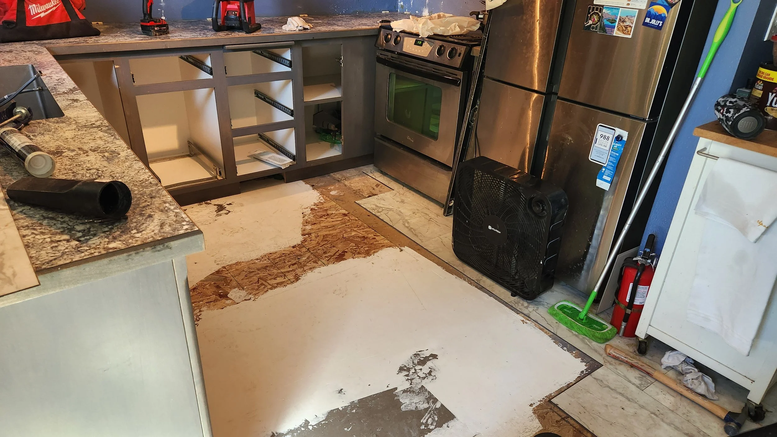 The dishwasher leaked so we had to pull the flooring and replace part of the subfloor and dry the floor out. We leveled out the transition from an old repair gone bad.
