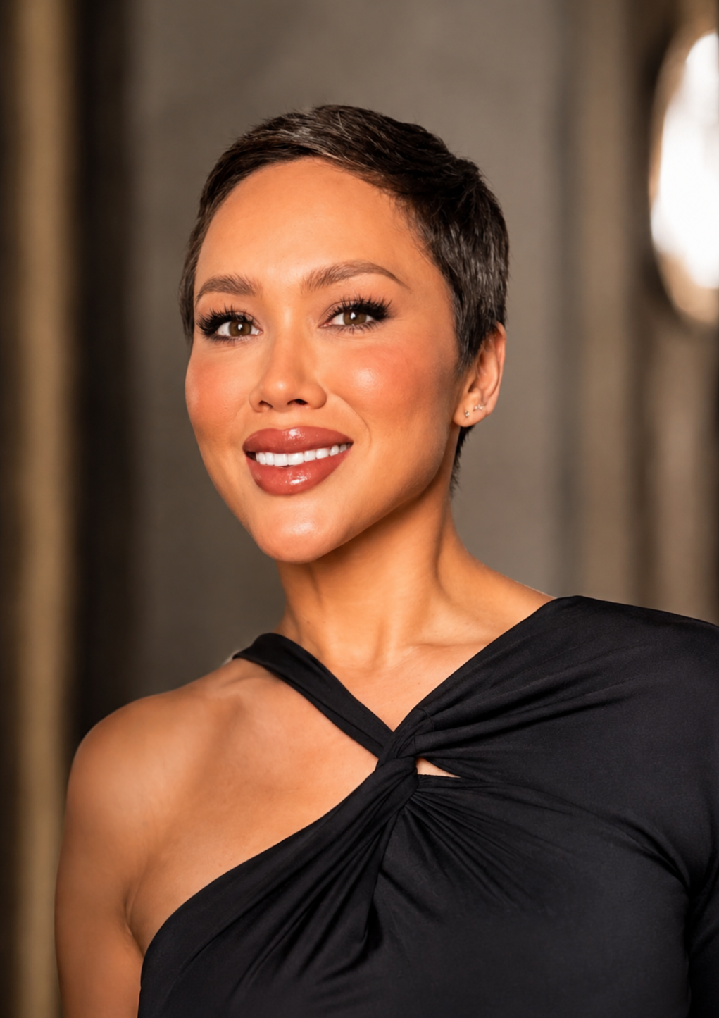 Keira Rowland, marketing executive, in a black blouse against a light gray background