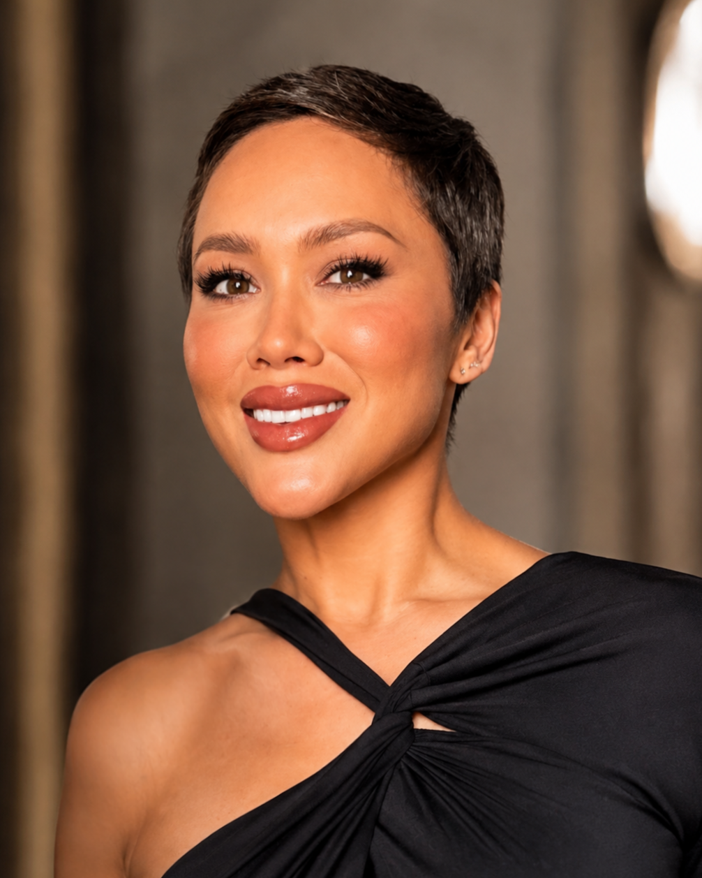 Keira Rowland, marketing executive, in a black blouse against a light gray background