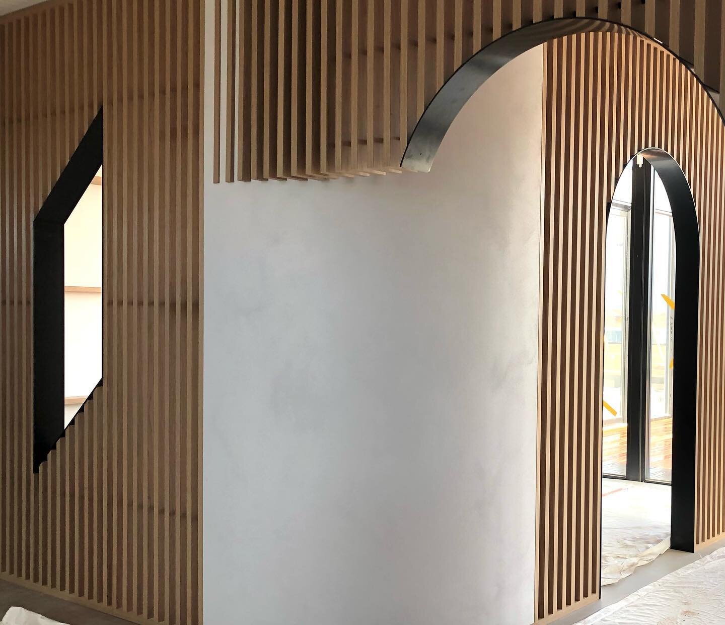Joinery elements for our project currently installing. These curved feature panels in @porterspaints Stone Paint are working nicely to balance the vertical battens and geometry of shape.
