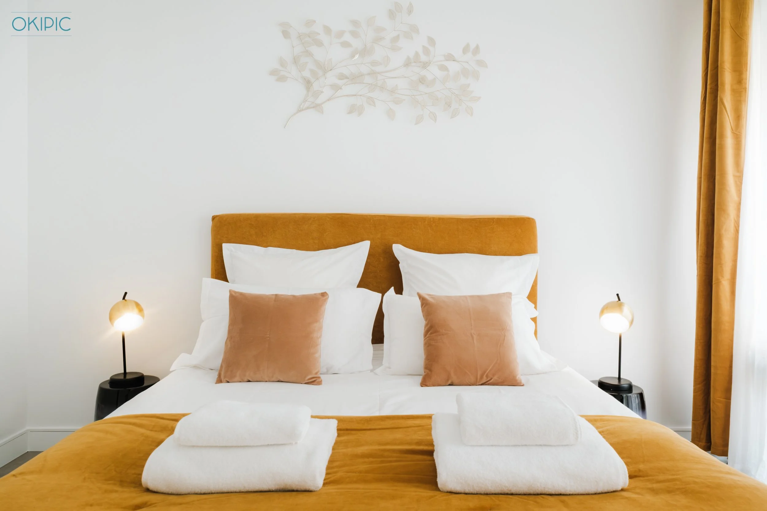 Serene bedroom (2) with plush double bed, luxe linens and warm lighting.
