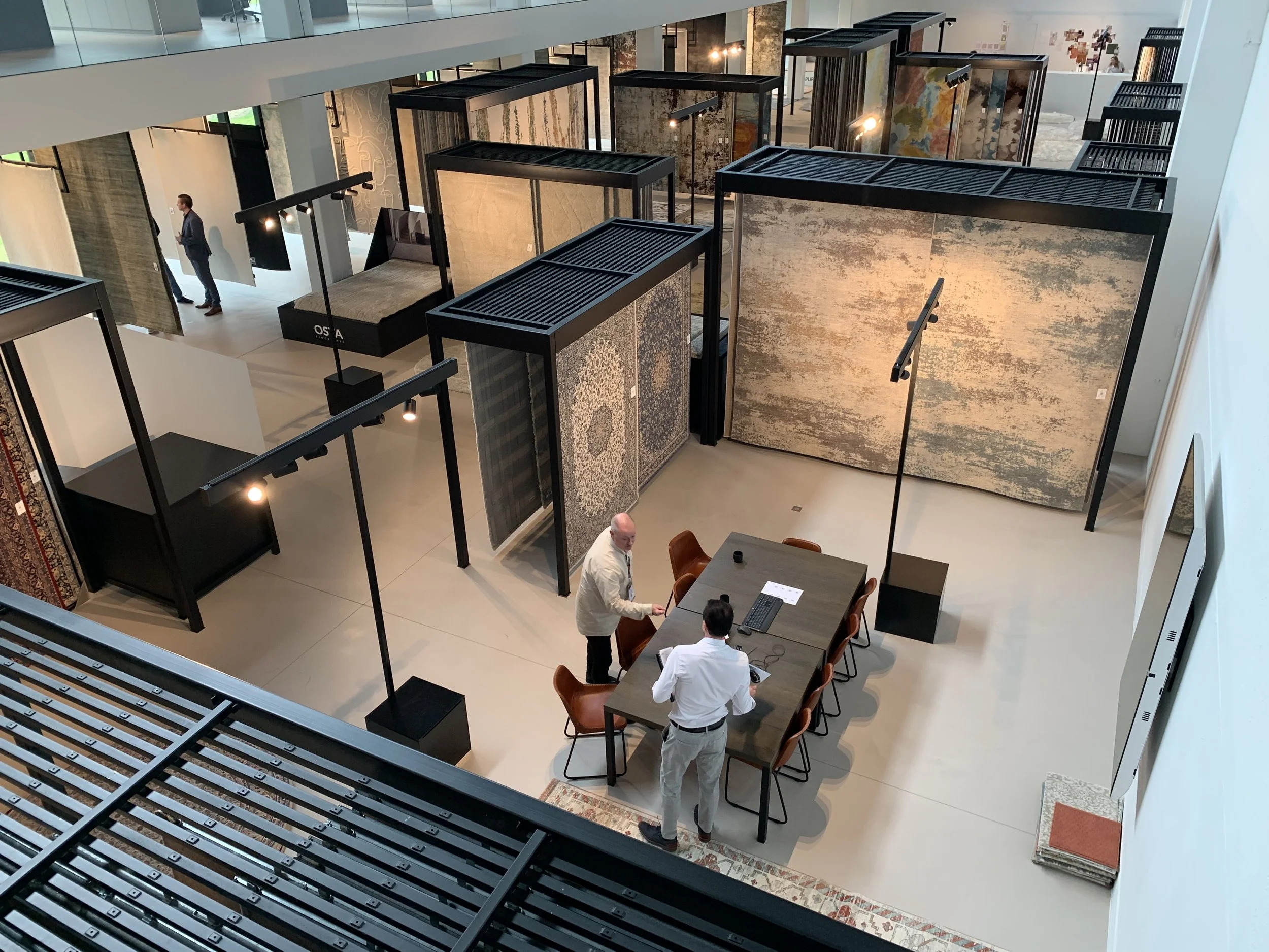 OSTA showroom in Harelbeke with woven rugs on display