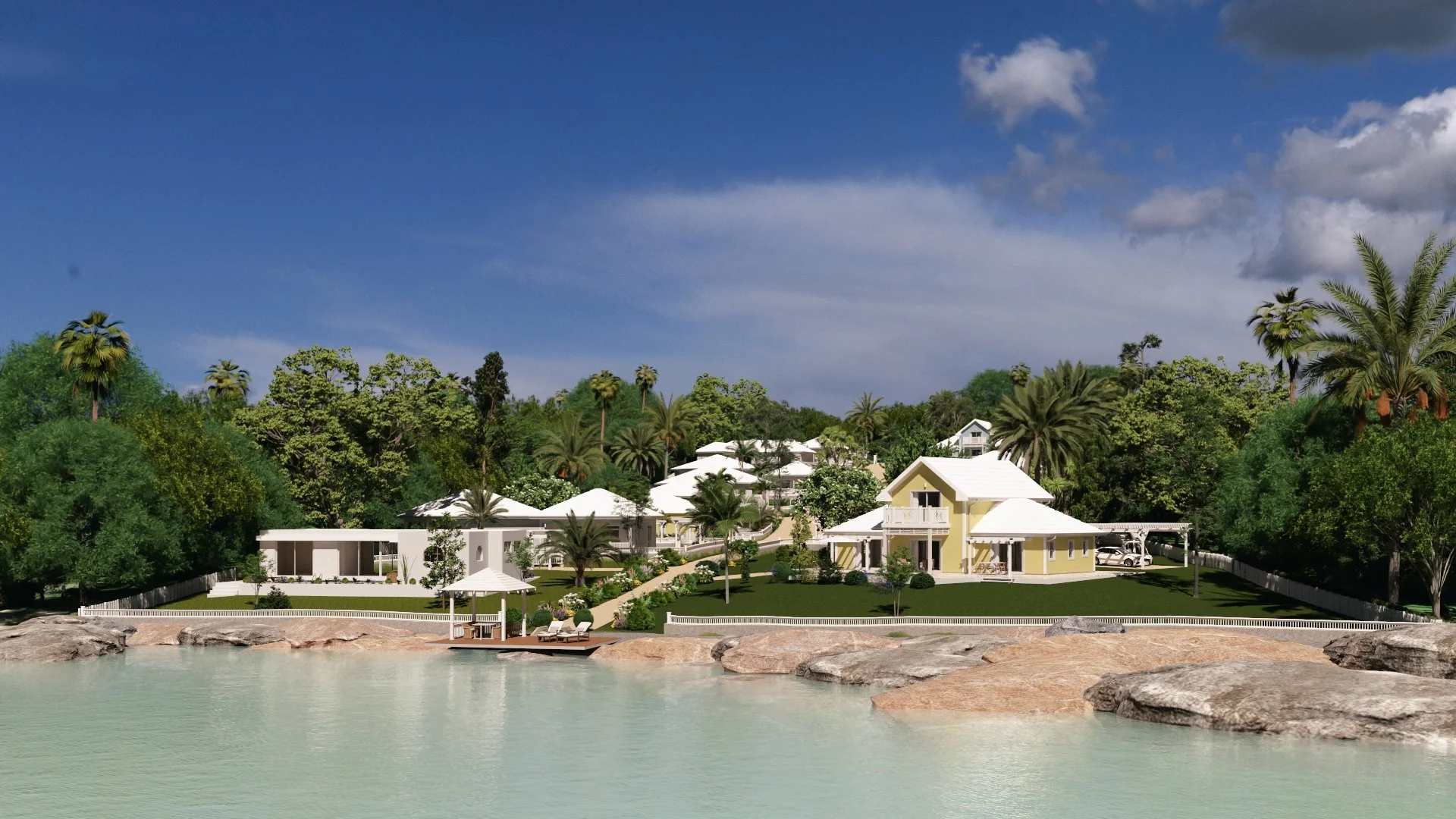 A luxurious coastal property with yellow and white houses, surrounded by lush palm trees and greenery, overlooking calm water with rocky shore and a small gazebo.