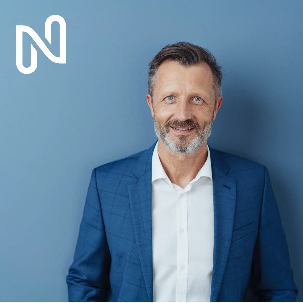 smart-friendly-businessman-smiling-at-the-camera-picture-id1248767732.jpg
