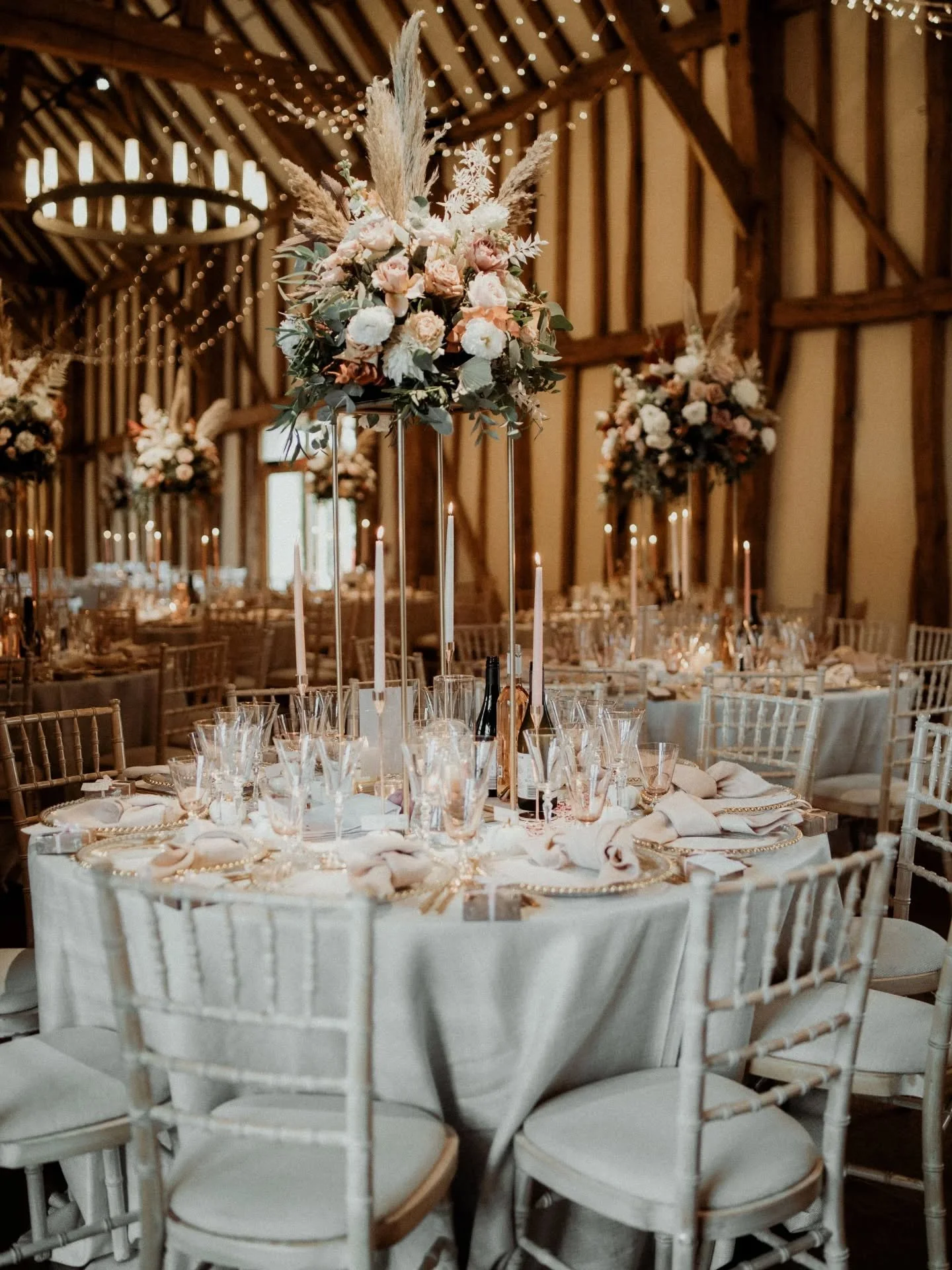Tall, statement table arrangements in the barn @micklefieldhall neutrals, blush &amp; dusky pink tones with autumnal foliage &amp; pampas grass 

Photo @mrmrs.k.photo 

#talltableflowers #talltablearrangement #talltablecentre #talltablecentrepiece #t