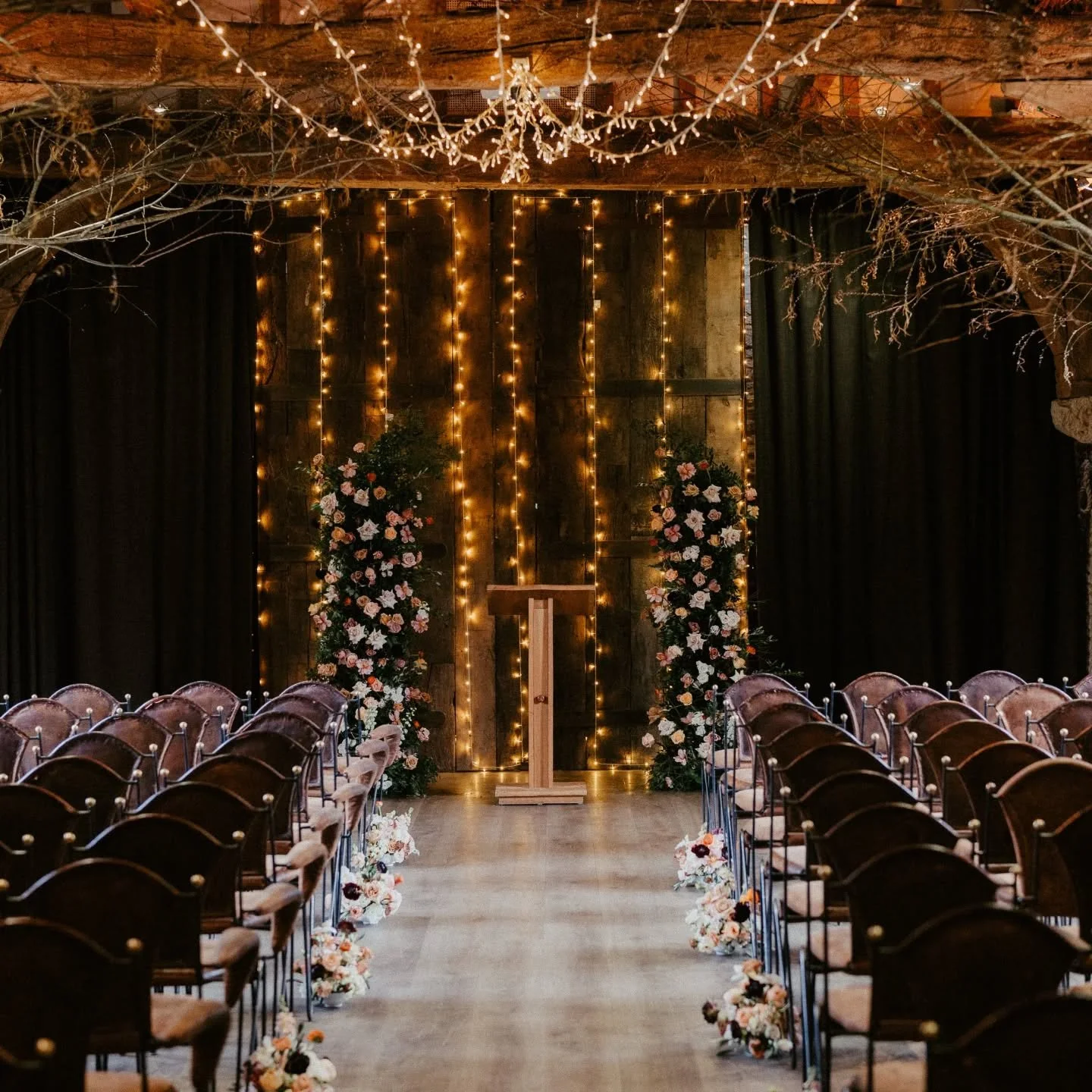 The prettiest winter wedding set up 😍 Flower columns &amp; bowl arrangements lining the aisle. All repurposed to the reception after the ceremony 🌸

Photo @jonnygouldstonephoto 
Venue @tythebarnlaunton 

#winterwedding #ceremonyflowers #flowercolum