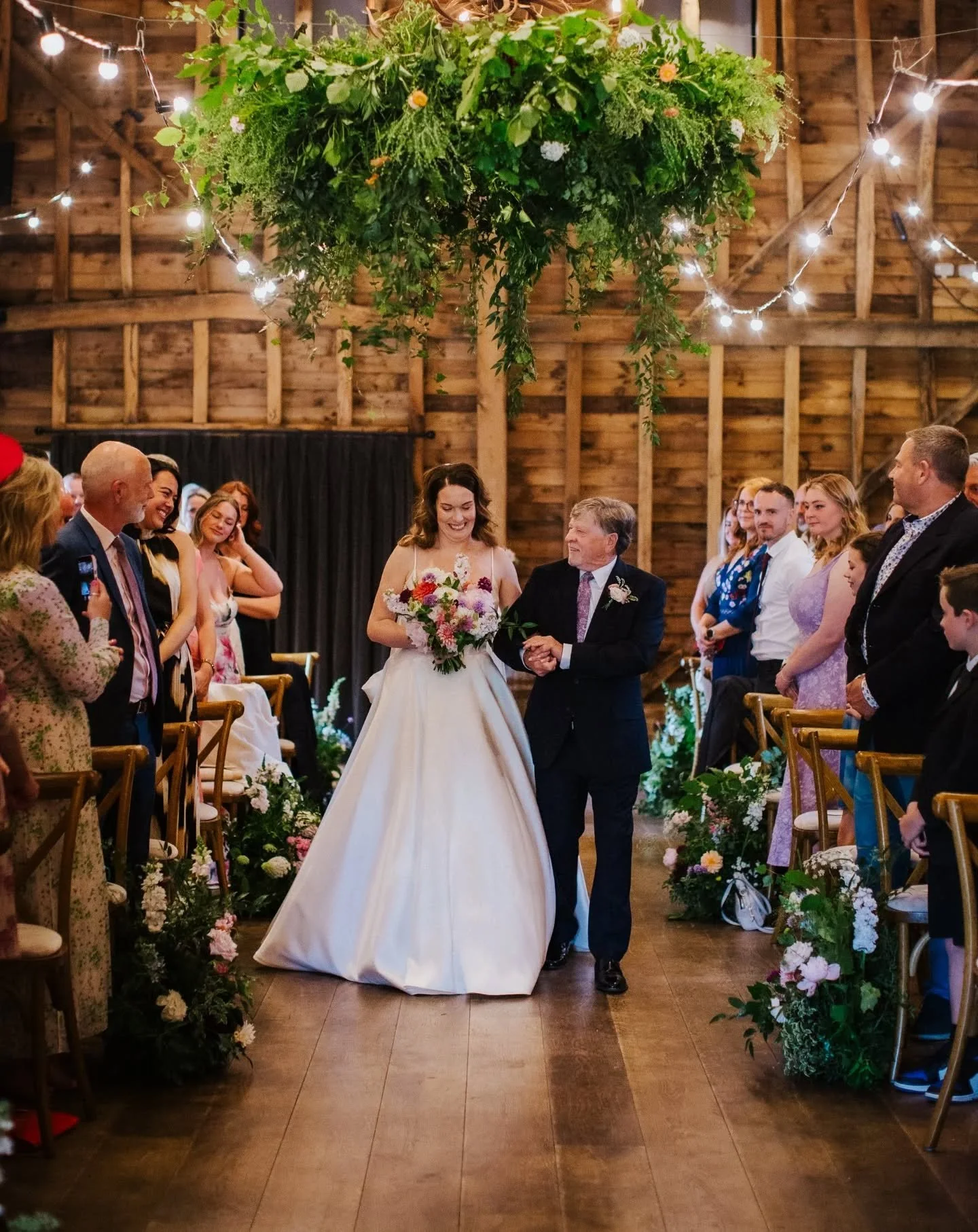 Sometimes foliage can create the wow factor in a space just as much as the florals. This foliage heavy hoop was a surprise for the Bride from the Groom 😍🌸 

Seasonal flower meadows lined the aisle for a pop of colour. The majority of this wedding w