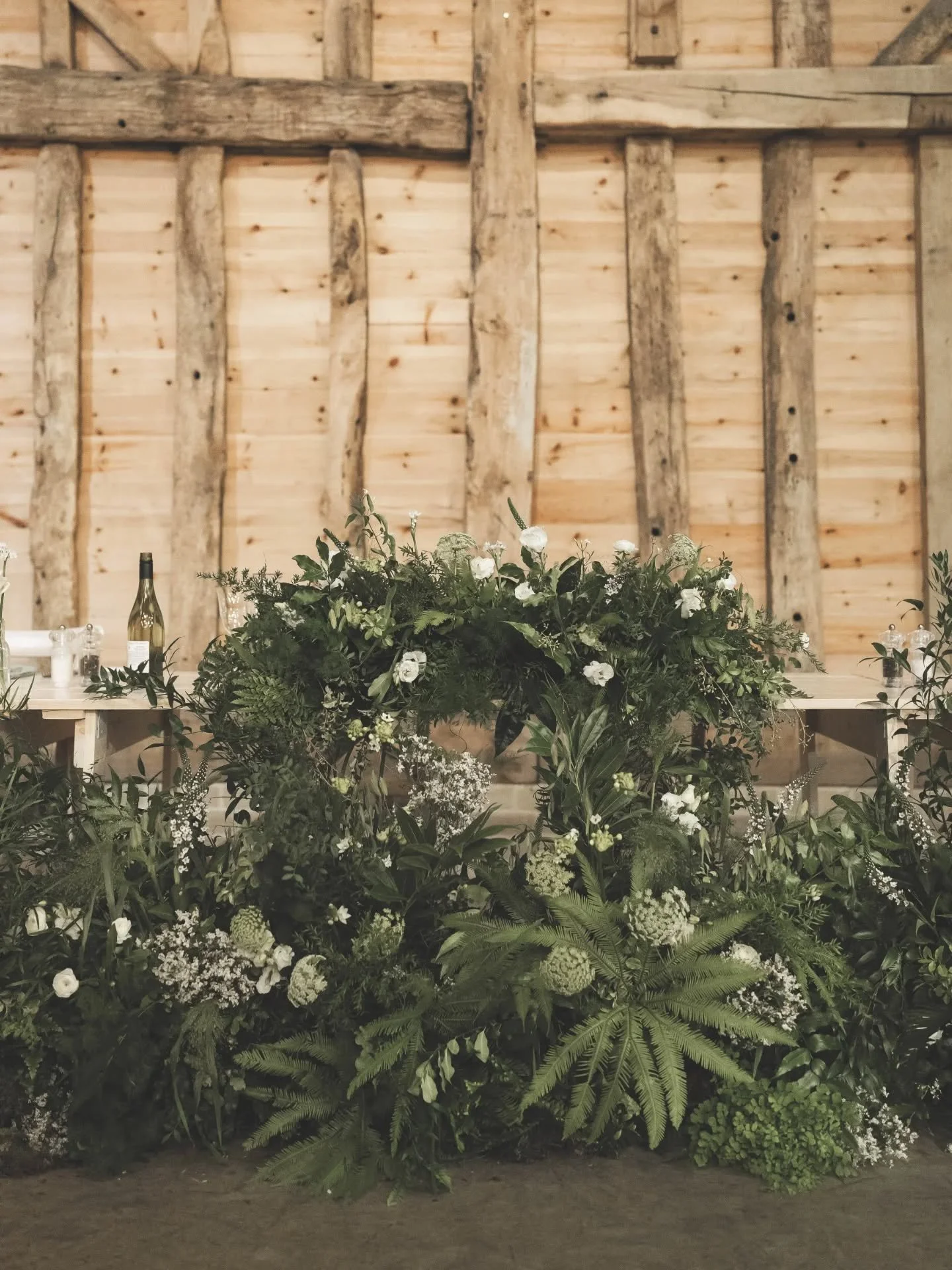 I loved all the textural foliage for Jamie &amp; Matthew's wedding. 🌿😍 We repurposed the ceremony backdrop to create a stunning meadow piece at the base of the top table. And the tall table centres created the added height into the stunning barn. 
