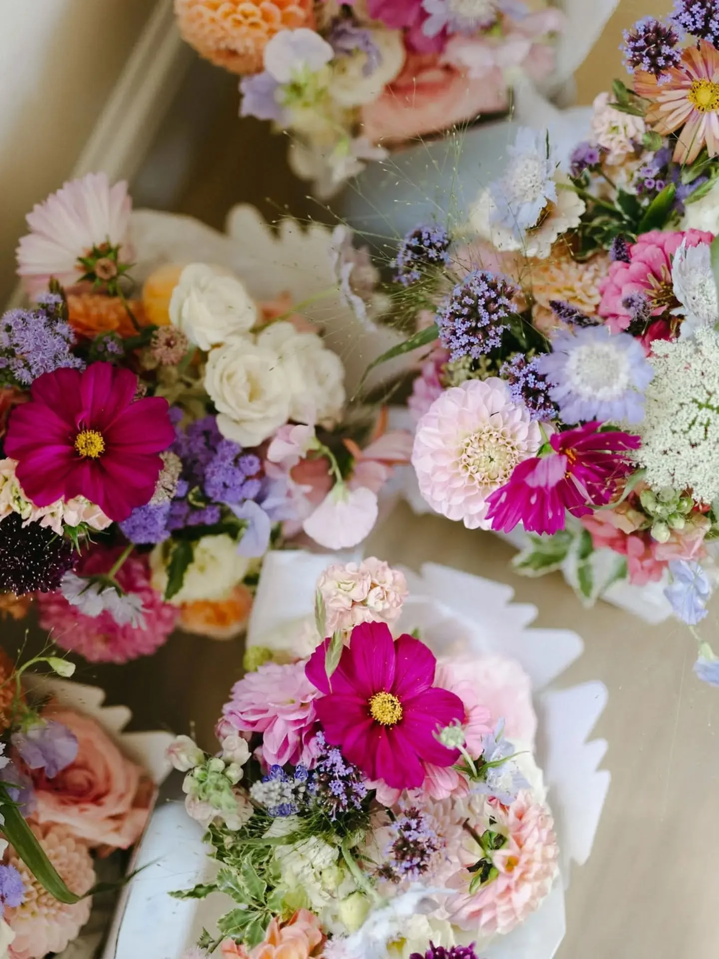A moment for these gorgeous bouquets, and the gorgeous ladies holding them. 🩷💞 Obsessed with the mix &amp; match pink bridesmaid dresses, and the pops of colour in the bouquets. The prettiest seasonal mix of British blooms for this stunning summer 