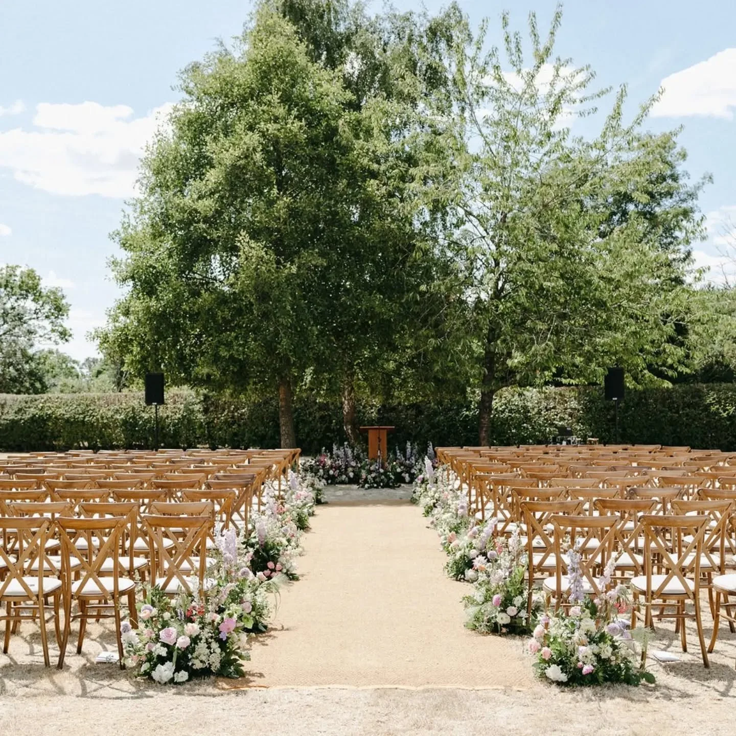 And this is the reason, I love aisle meadows! 😍 How stunning does this ceremony aisle look?! In such a beautiful garden setting, with a gorgeous crescent meadow to frame the couple, and trees as the backdrop. 

All repurposed across to the sail clot