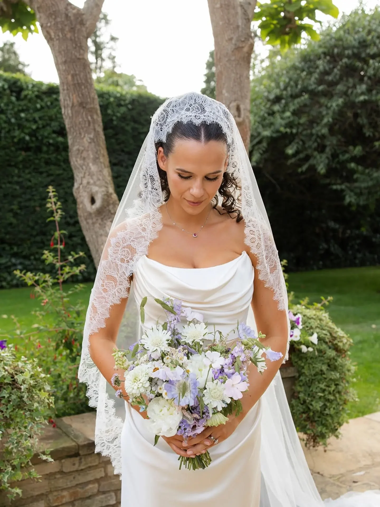 Beautiful bride, Talia, with her bouquet. A gorgeous mix of lilac &amp; neutral toned British blooms with small hints of blush &amp; pale blue. I loved all the soft whispy flowers in this bouquet, so pretty😍 

From one of this year's stunning garden