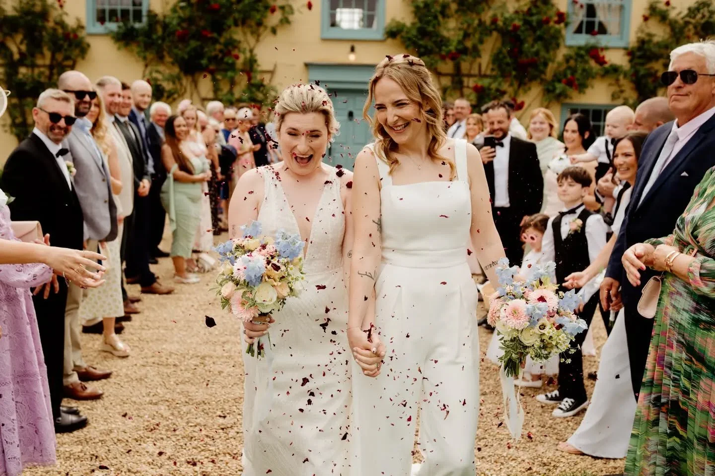 A gorgeous confetti shot of the lovely Grace &amp; Paige 🌸 matching pastel bouquets with a mix of peach, pinks &amp; blues for a lovely summer wedding @southfarmweddings 

Photo @bubearphotography 

#hertfordshireflorist #bedfordshireflorist #southf