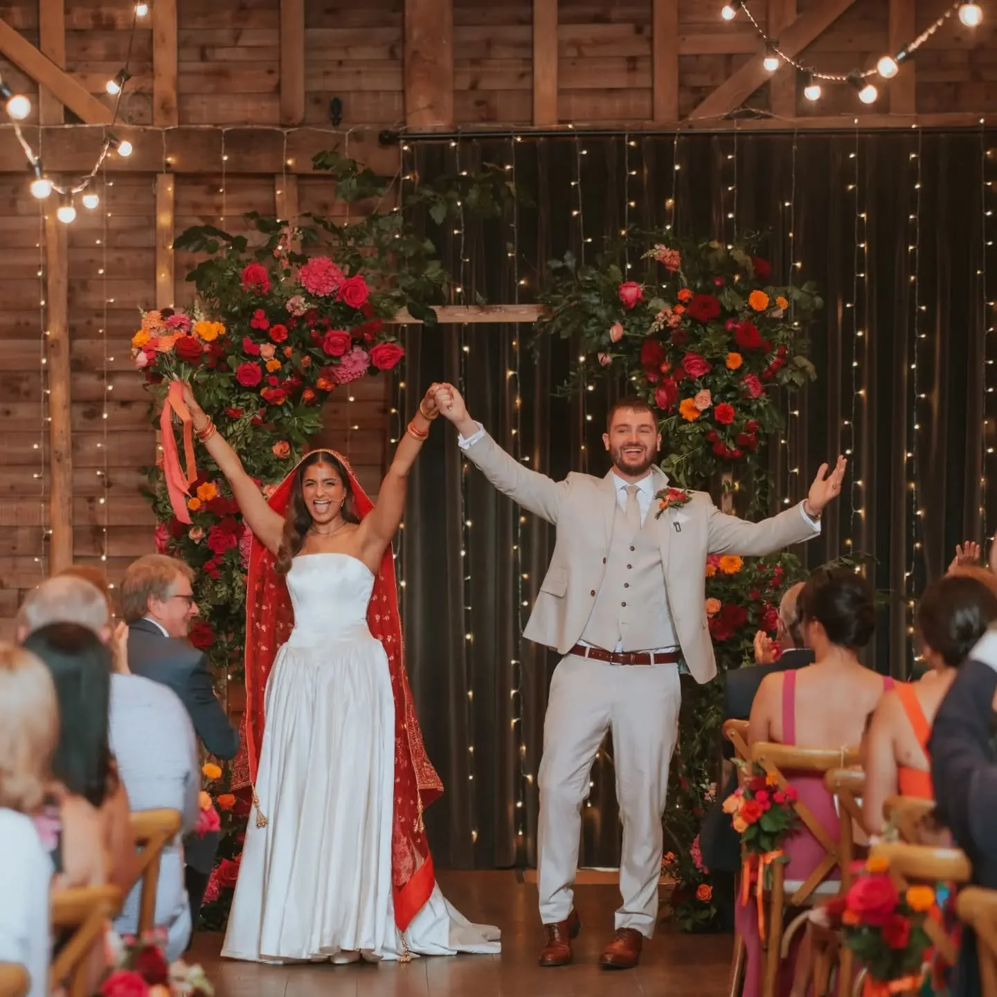 Gorgeous rich jewel tones for this ceremony set up. A wooden arch framed backdrop to create a focal point in the barn, and tied bunches to the chairs to add some colour down the aisle. 

The preview images from Ruju &amp; Tom's wedding are soooo good