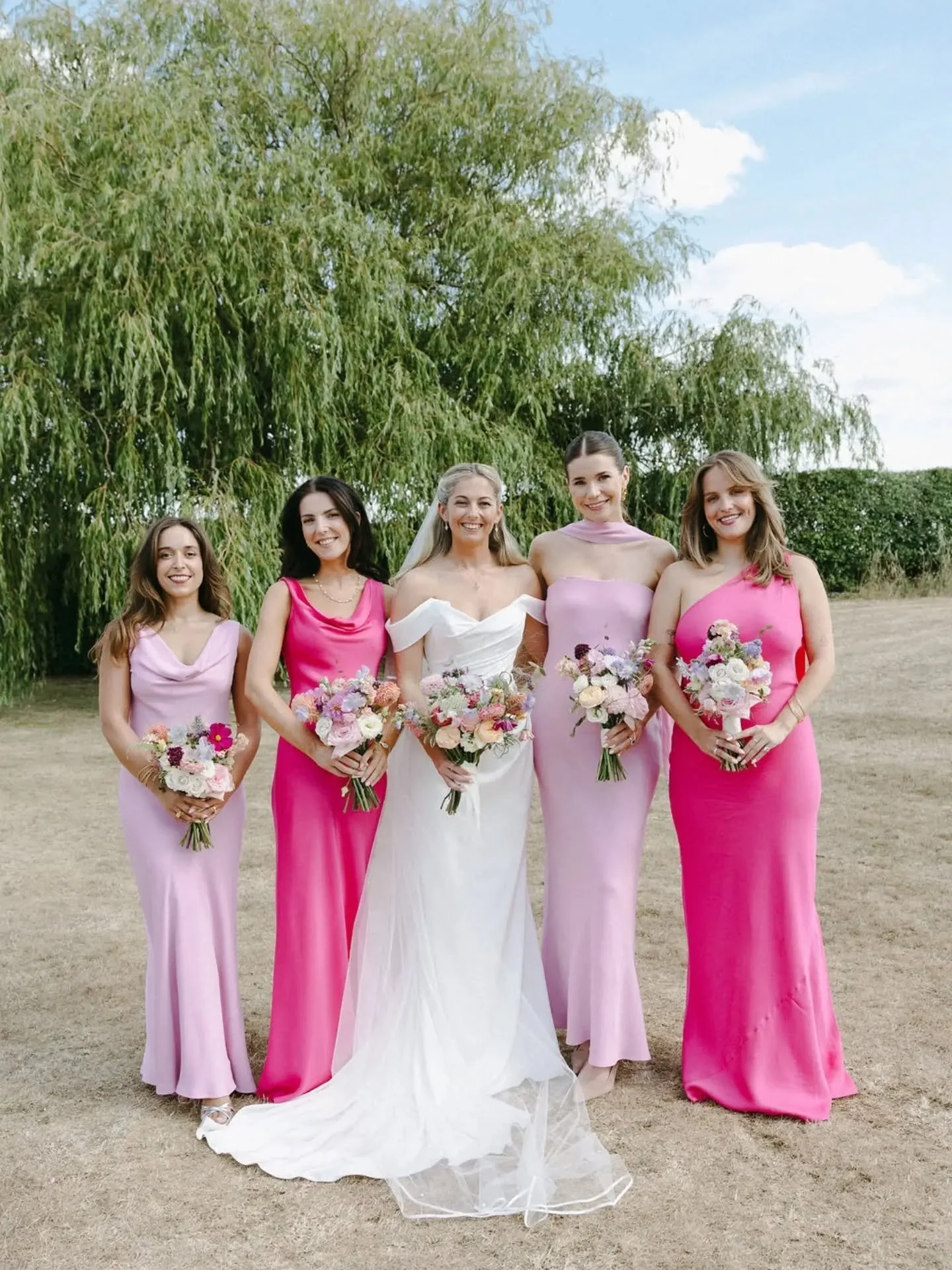 Sacha &amp; her Bridesmaids. 🩷💖 I do always love mix &amp; match styles for the bridesmaids dresses. 

This was a beautiful summer colour palette using lots of stunning British blooms 🌸

Photo @sharbinson 

#bridesmaidbouquet #summerweddingflowers