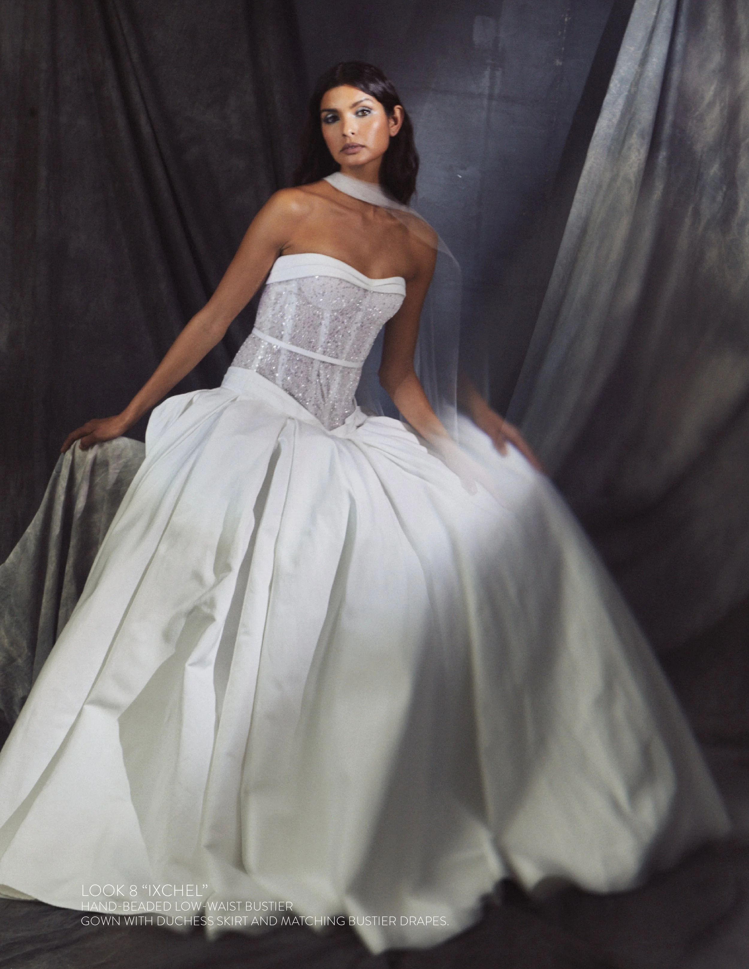 IXCHEL GOWN - Hand-Beaded low-waist bustier gown with duchess skirt and matching bustier drapes.