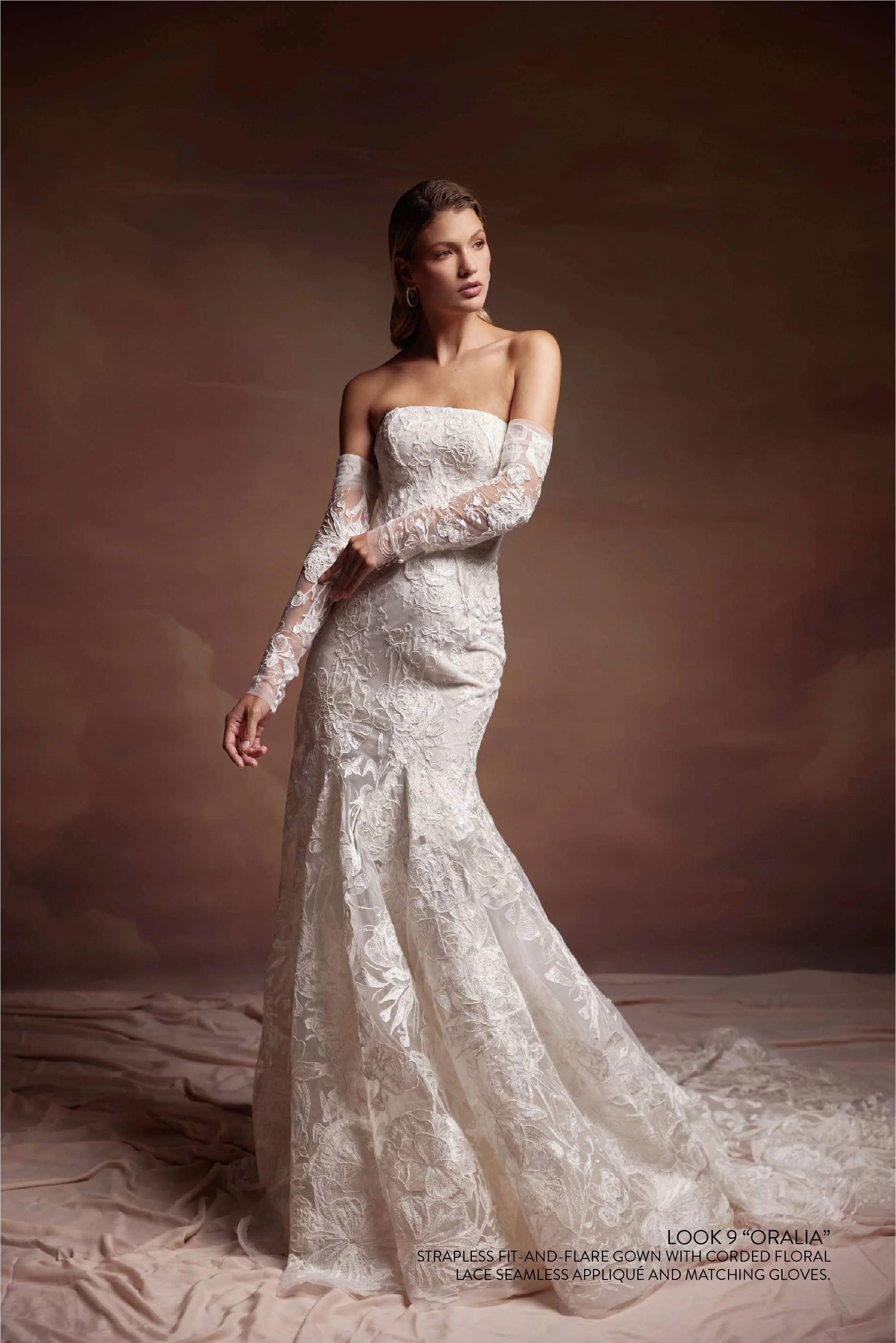 ORALIA GOWN - Strapless fit and flare gown with corded floral lace seamless appliqué.