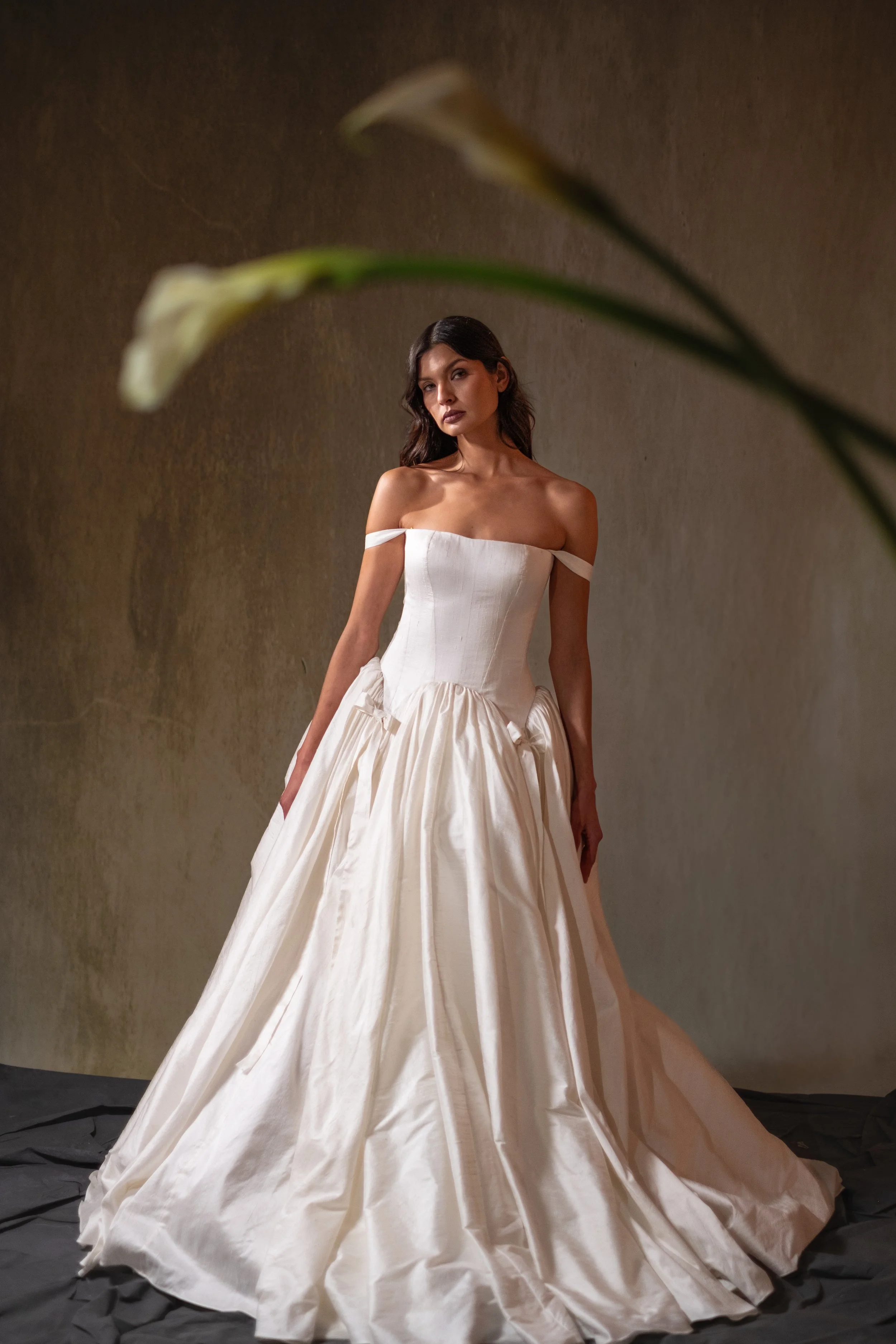 Dupion ball gown with arched skirt and straight bustier.