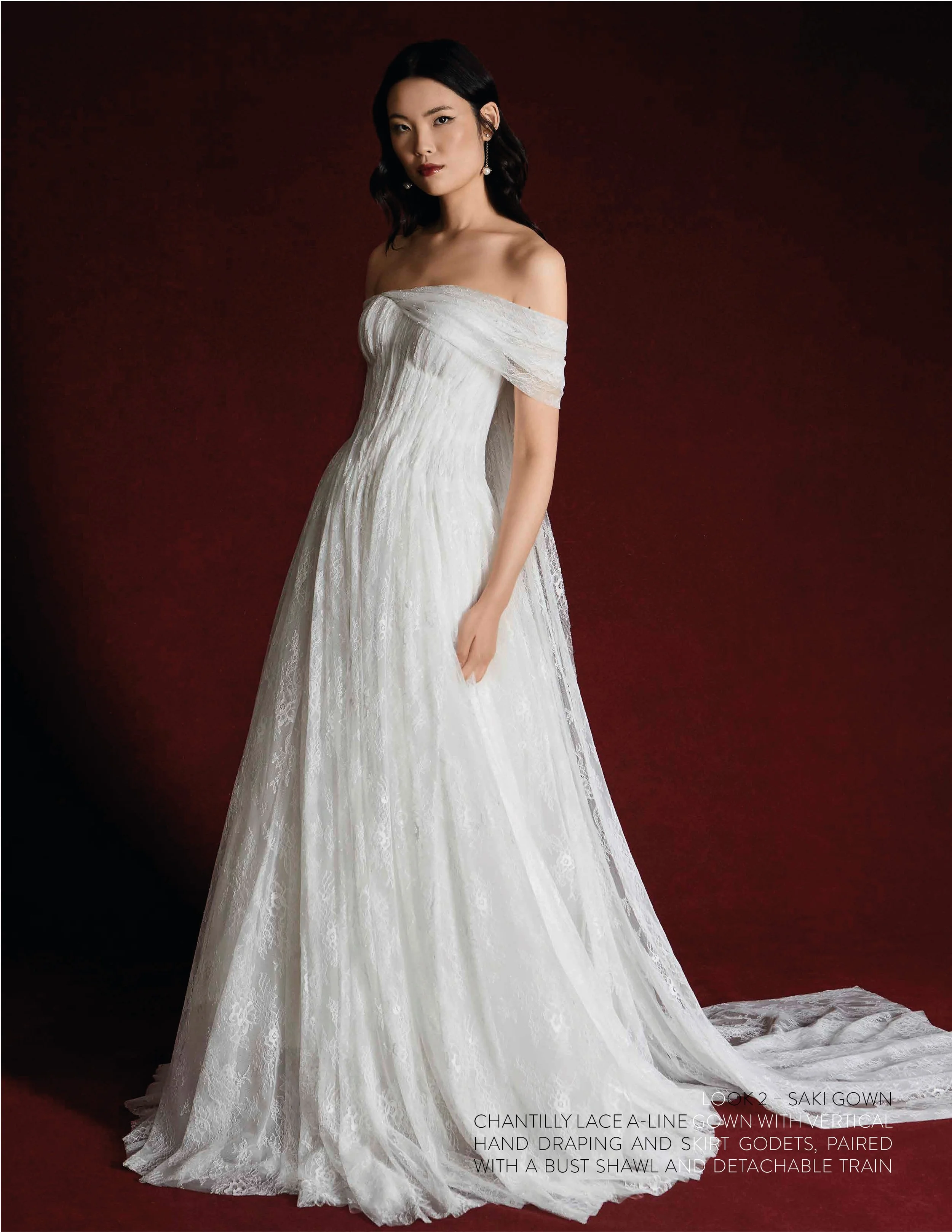 SAKI GOWN - Chantilly Lace "A" line gown with vertical hand drape and godets in skirt paired with bust shawl and train cape.