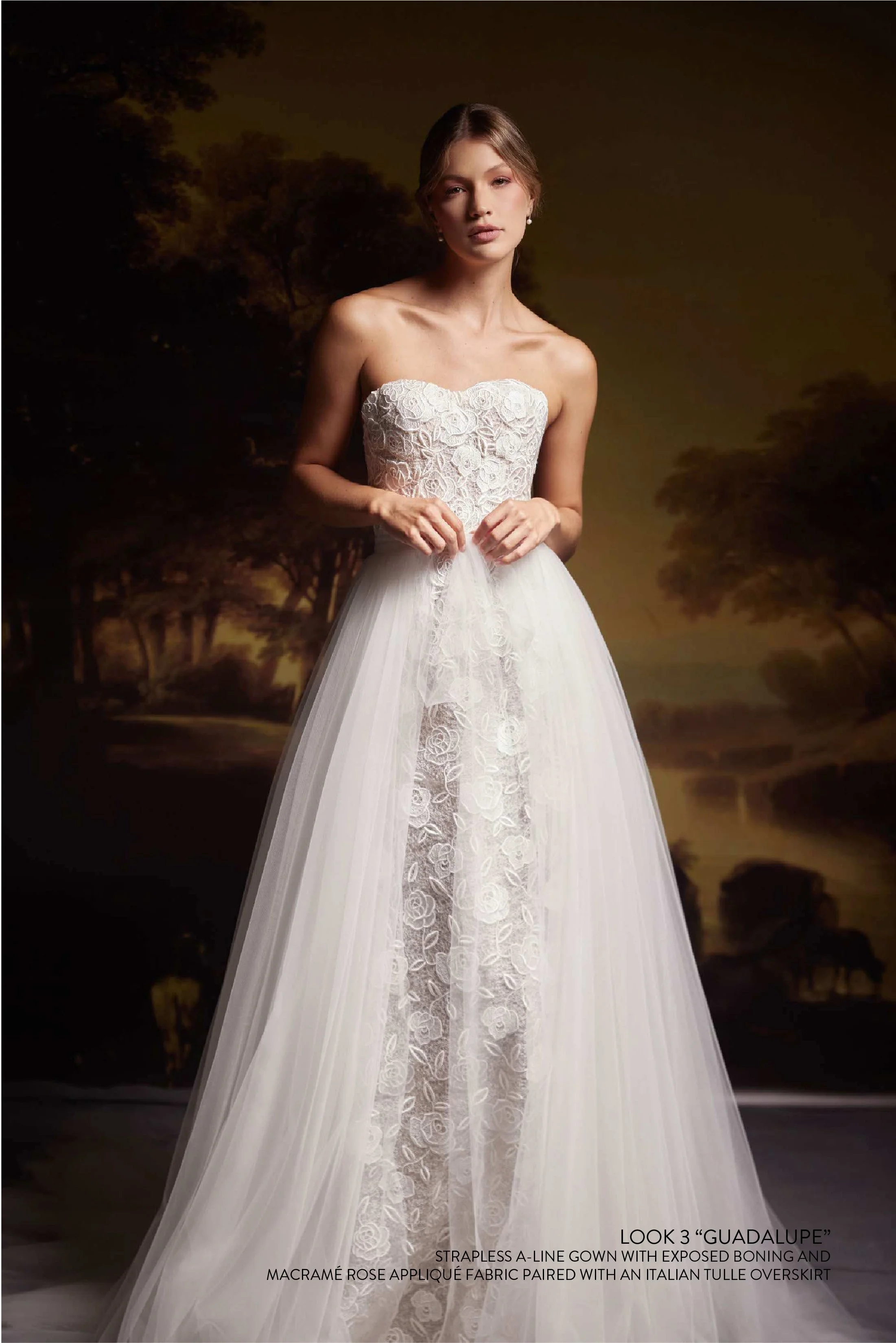 GUADALUPE GOWN - STRAPLESS A-LINE GOWN WITH EXPOSED BONING AND MACRAMÉ ROSE APPLIQUÉ FABRIC PAIRED WITH A MATCHING SLEEVELESS BOLERO WITH COVERED BUTTONS