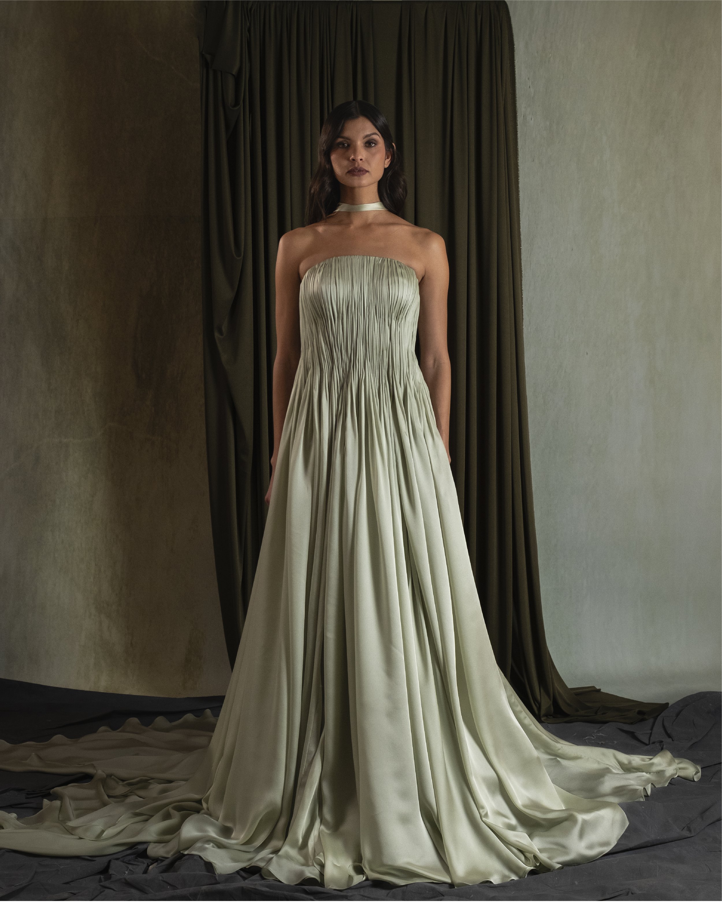 Hand-Draped A line gown with curved neckline in silk satin georgette.