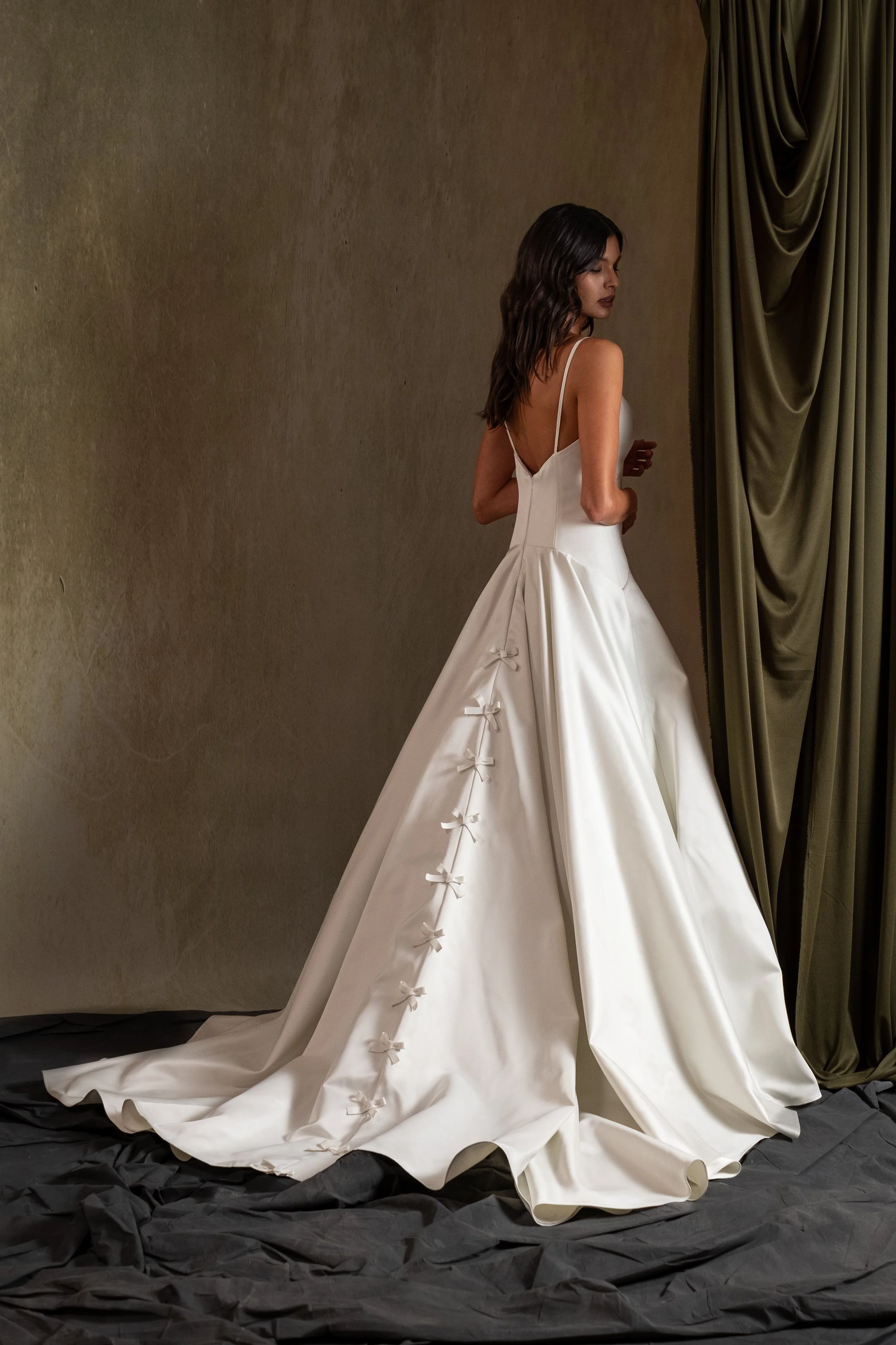 DITZA GOWN - Semi Satin Crepe ball gown with drop waist and V neckline with bow detail in center back.