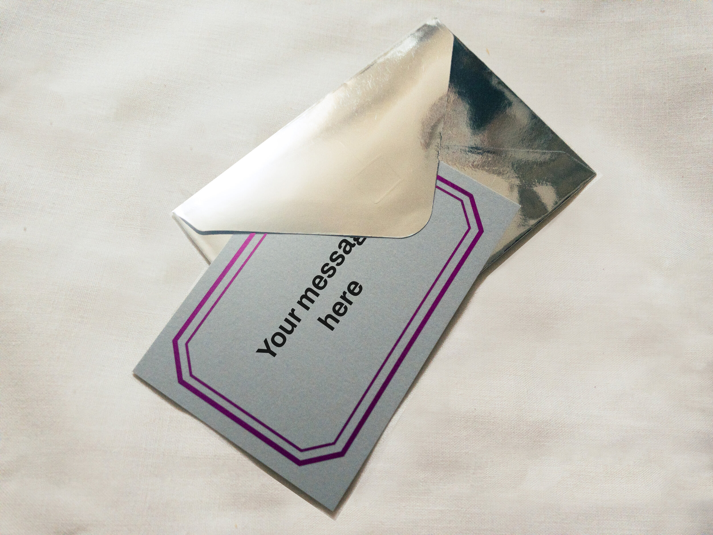 Pale grey gift notecard, with metallic silver envelope.