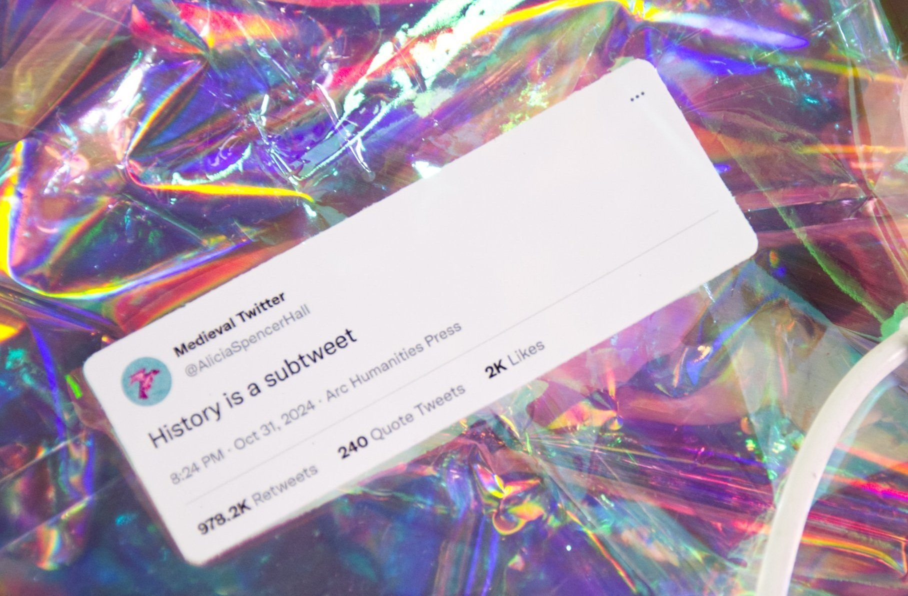 A sticker of a fake tweet reading "History is a subtweet", posted by Medieval Twitter