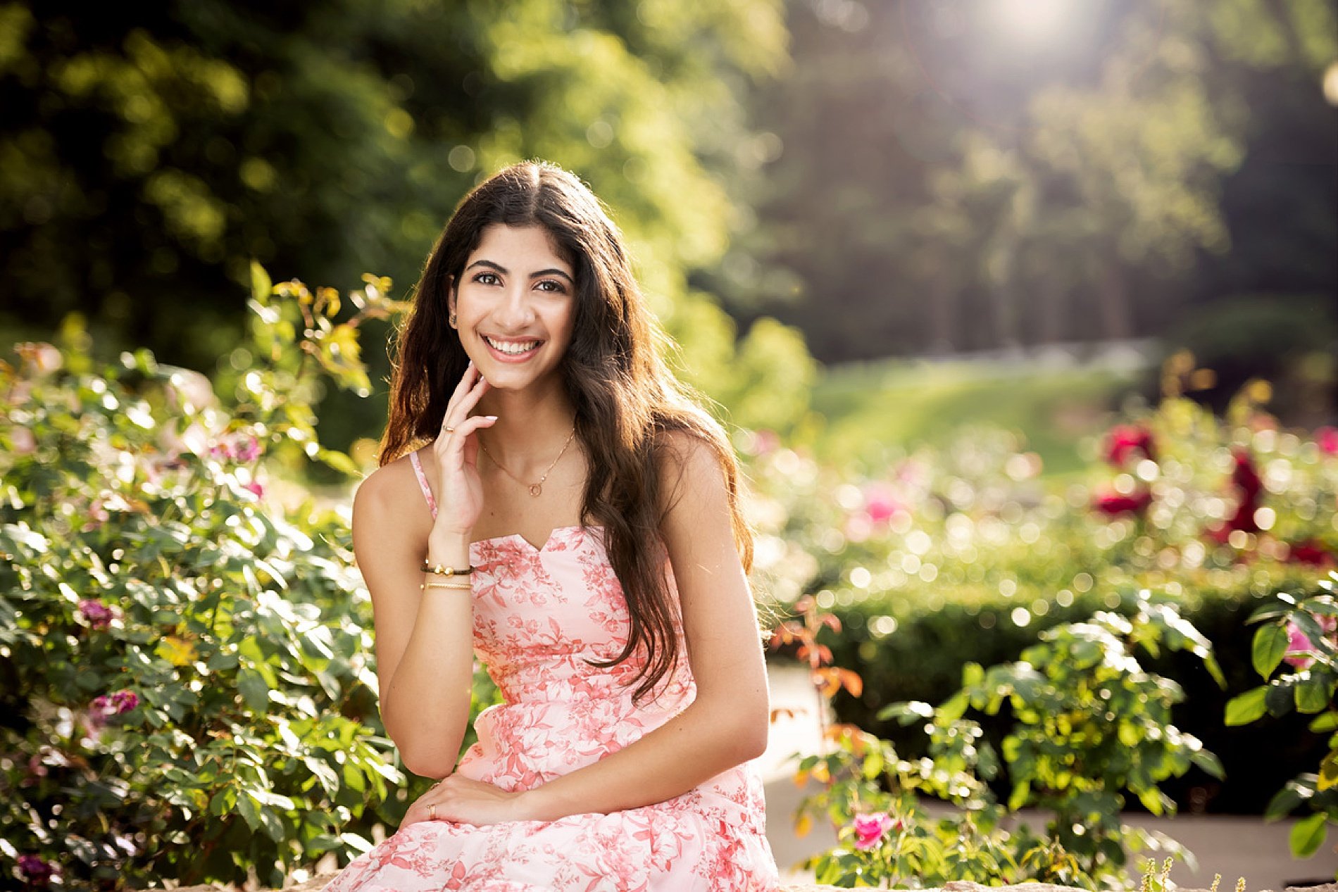  What Season is Right For Your Senior Session? Spring Senior session with flowers blooming in the background 
