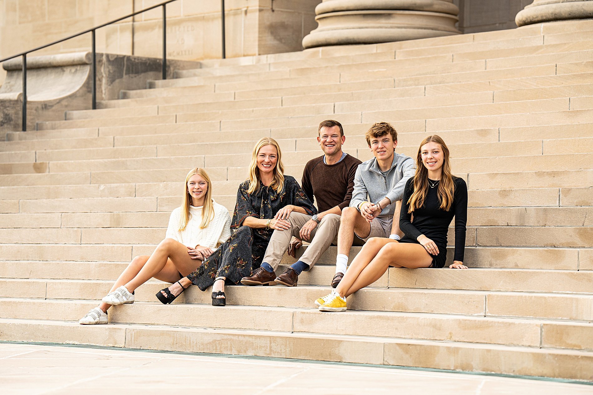  family of five sit on stairs at Museum of Art in Kansas City 