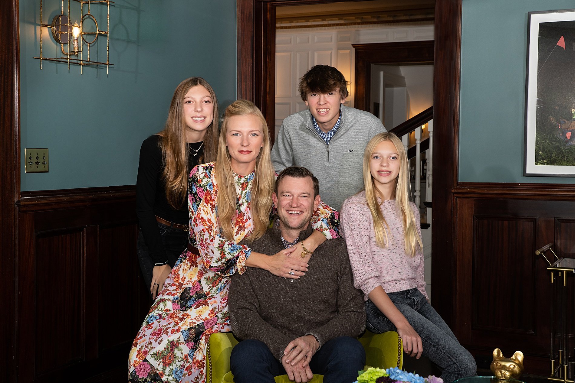  Family of five sit together during Kansas City in-home family session 