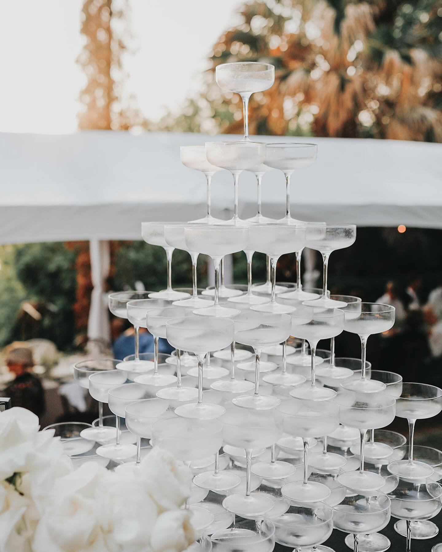 Champagne towers are no small feat (trust us) 🥂

#austincatering #austinevents #weddingphotography