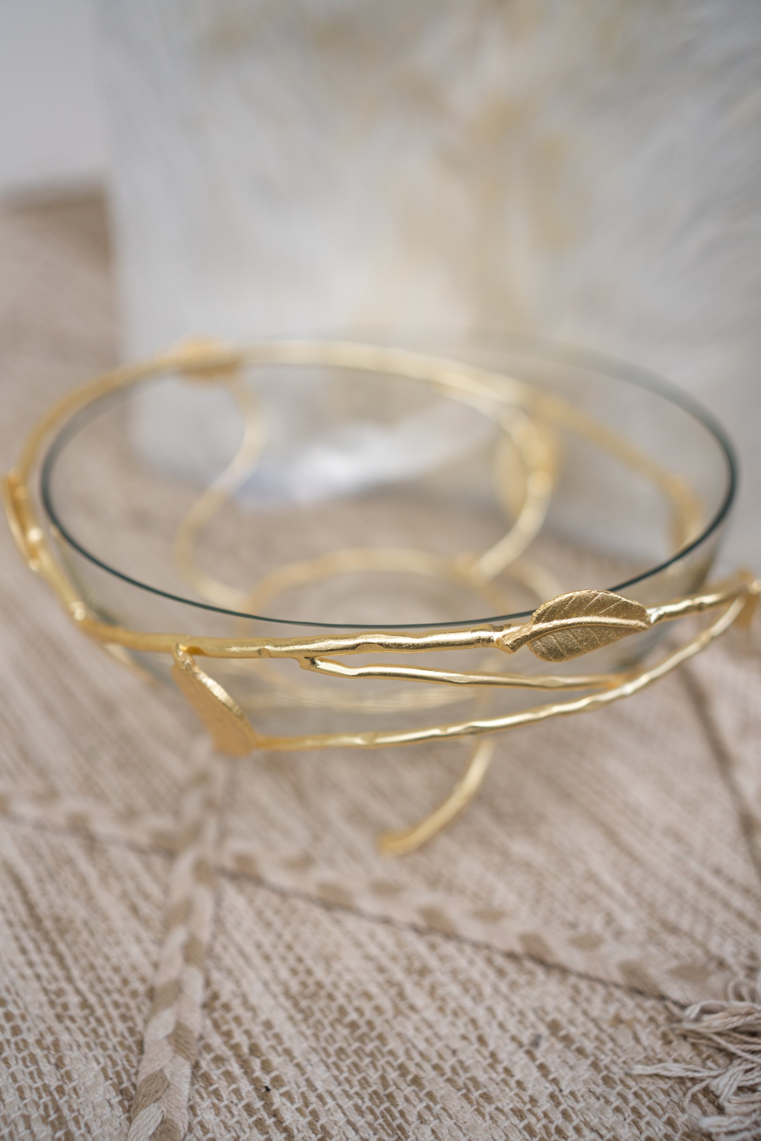 Noora's Golden Leaf Decorative Bowl, a harmonious blend of natural elegance and modern design, with intricate leaf patterns in gold